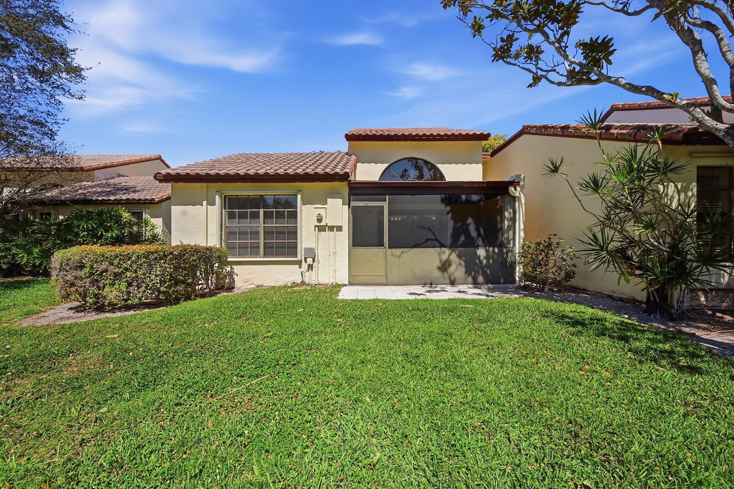 440 Ashwood Place Boca Raton, FL 33431 - Photo 27 of 32 a view of a house with backyard and porch
