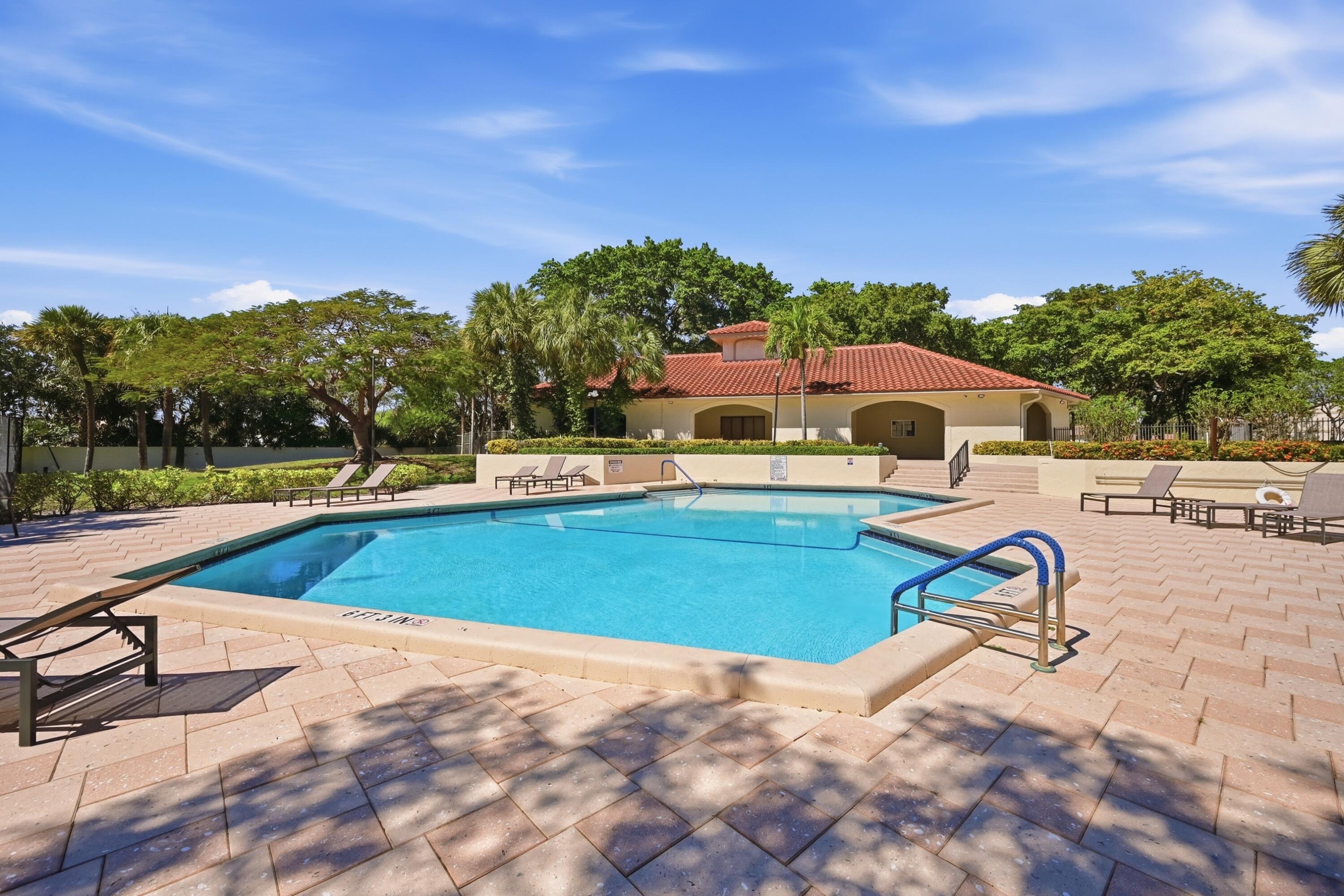 440 Ashwood Place Boca Raton, FL 33431 - Photo 29 of 32 a view of a swimming pool with a lake view
