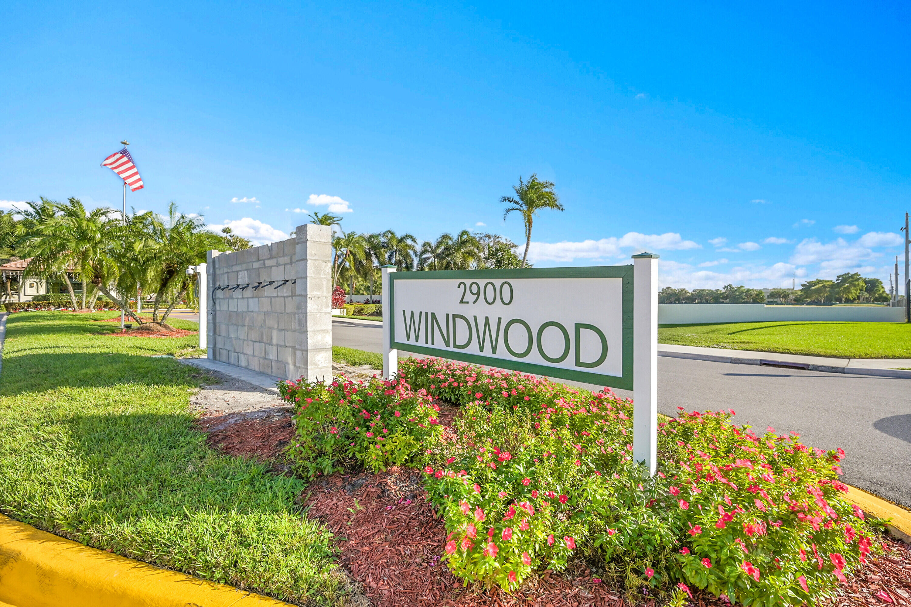 440 Ashwood Place Boca Raton, FL 33431 - Photo 32 of 32 a sign that is on the side of a road