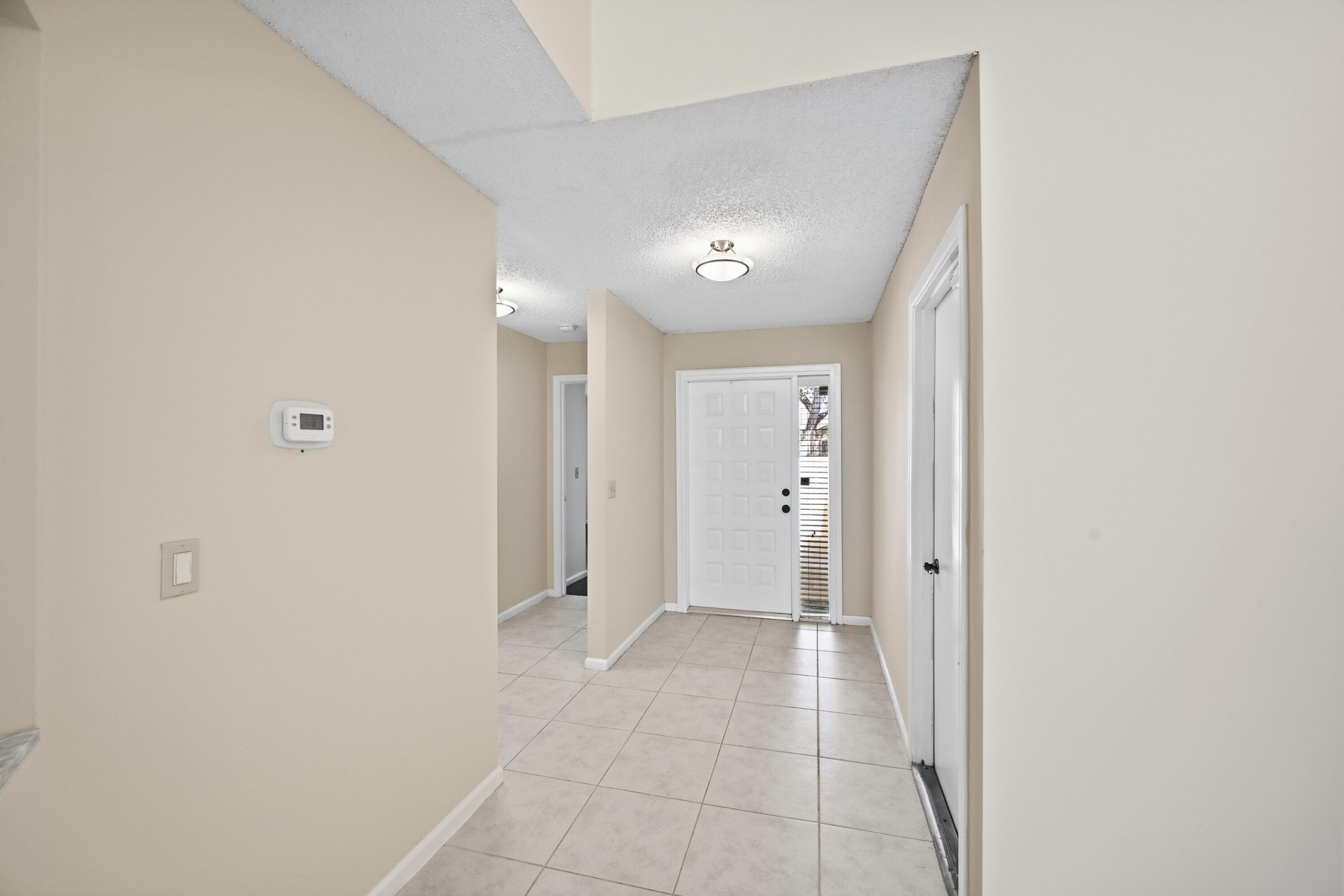 440 Ashwood Place Boca Raton, FL 33431 - Photo 5 of 32 a view of a hallway with a room