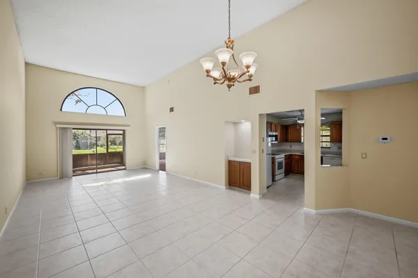a large kitchen with stainless steel appliances granite countertop a stove and a sink