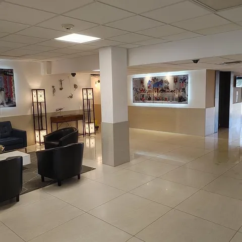 a view of a living room with furniture and a window