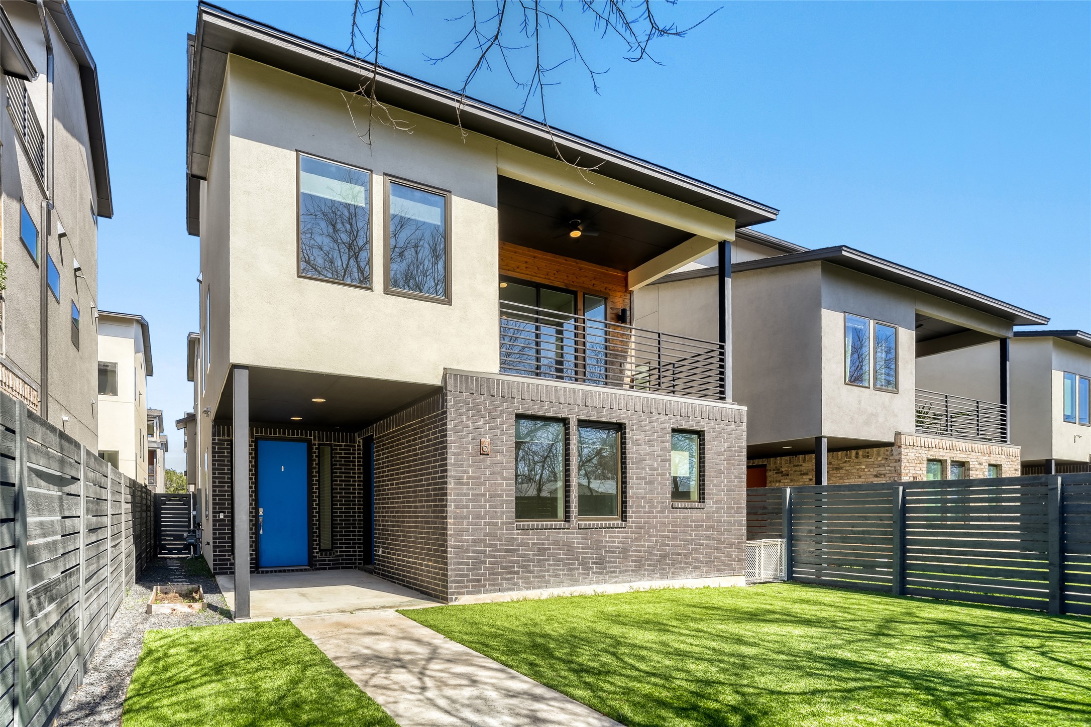 5002 Pecan Springs Road, Unit 6 Austin, TX 78723 - Photo 1 of 29 a front view of a house with a garden