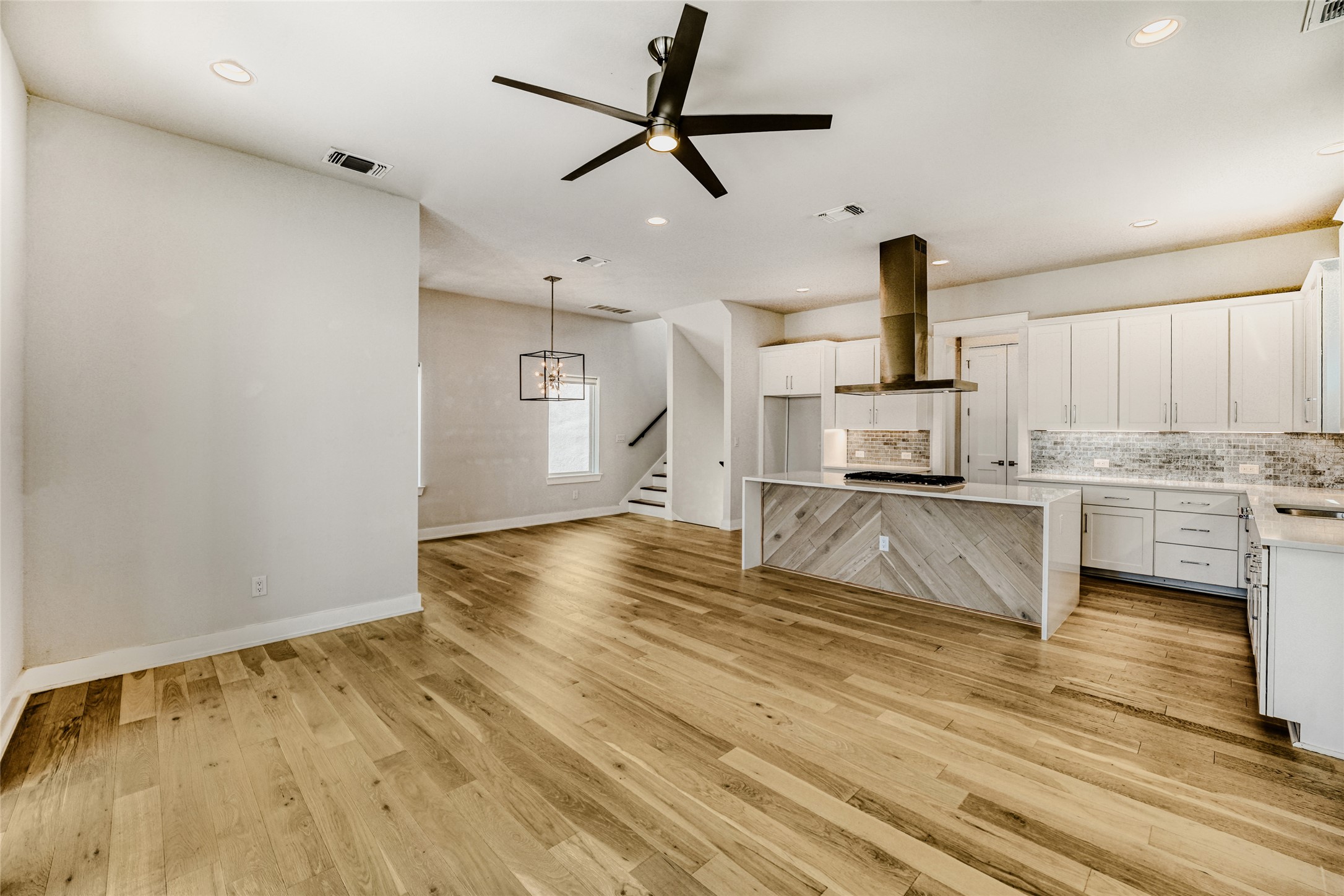 5002 Pecan Springs Road, Unit 6 Austin, TX 78723 - Photo 11 of 29 a kitchen with kitchen island a counter top space appliances and cabinets
