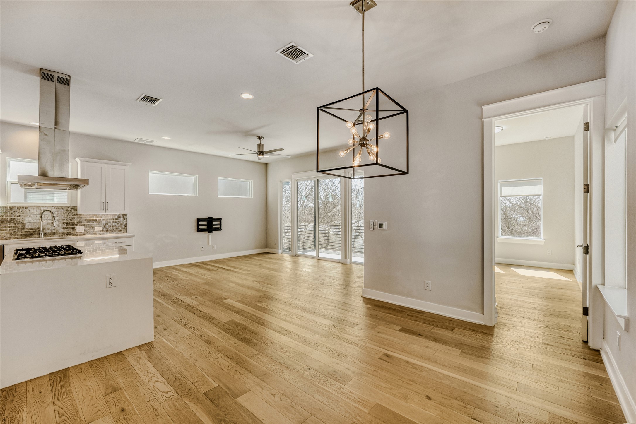 5002 Pecan Springs Road, Unit 6 Austin, TX 78723 - Photo 13 of 29 a view of a kitchen with a sink and wooden floor