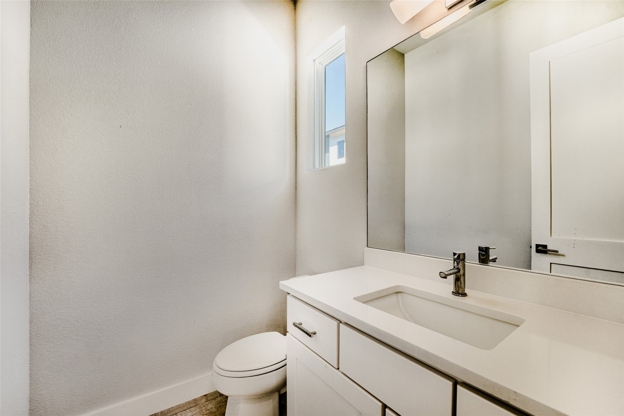 5002 Pecan Springs Road, Unit 6 Austin, TX 78723 - Photo 14 of 29 a bathroom with a sink toilet and a mirror