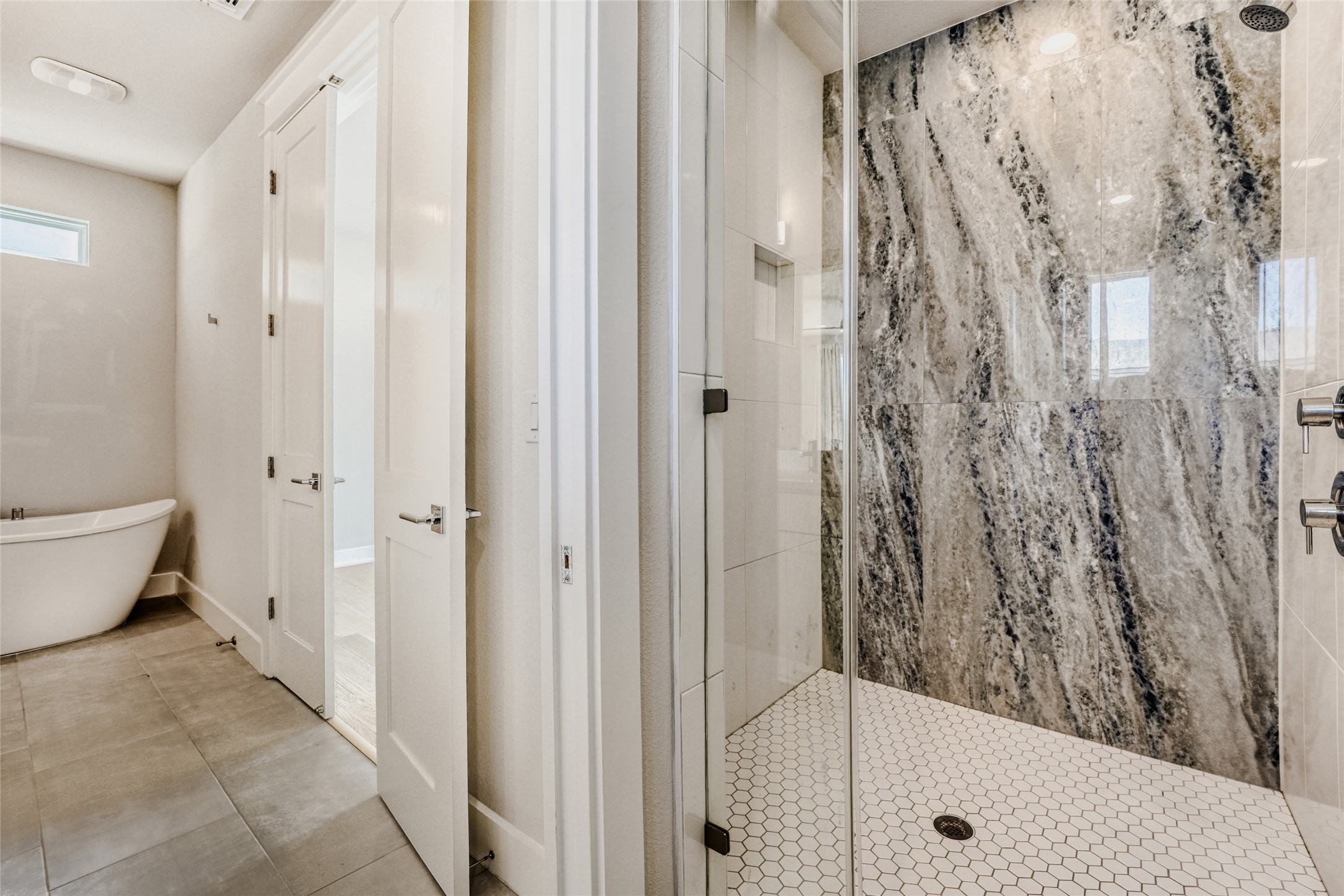 5002 Pecan Springs Road, Unit 6 Austin, TX 78723 - Photo 26 of 29 a bathroom with a tub and shower