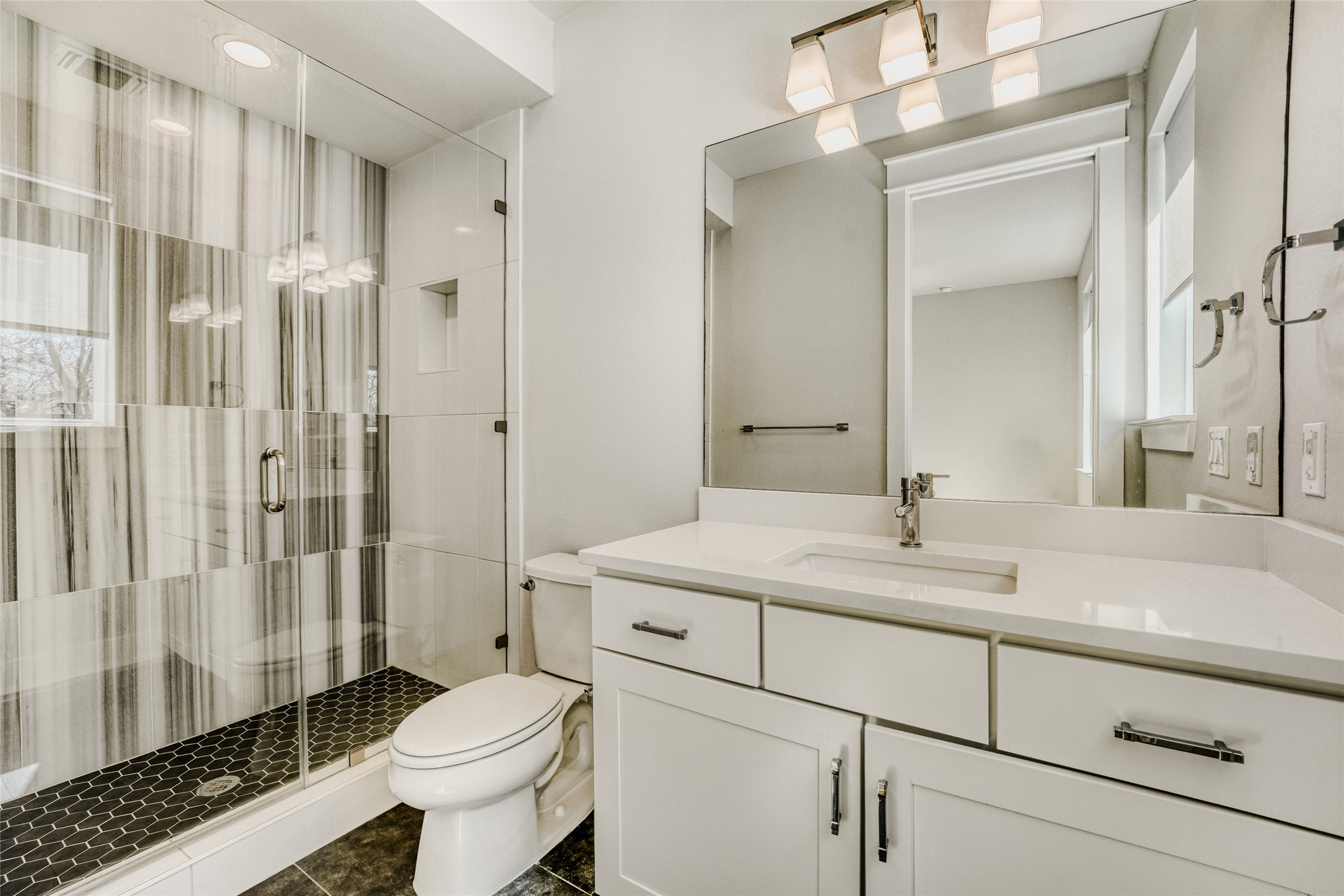 5002 Pecan Springs Road, Unit 6 Austin, TX 78723 - Photo 27 of 29 a bathroom with a sink toilet and shower