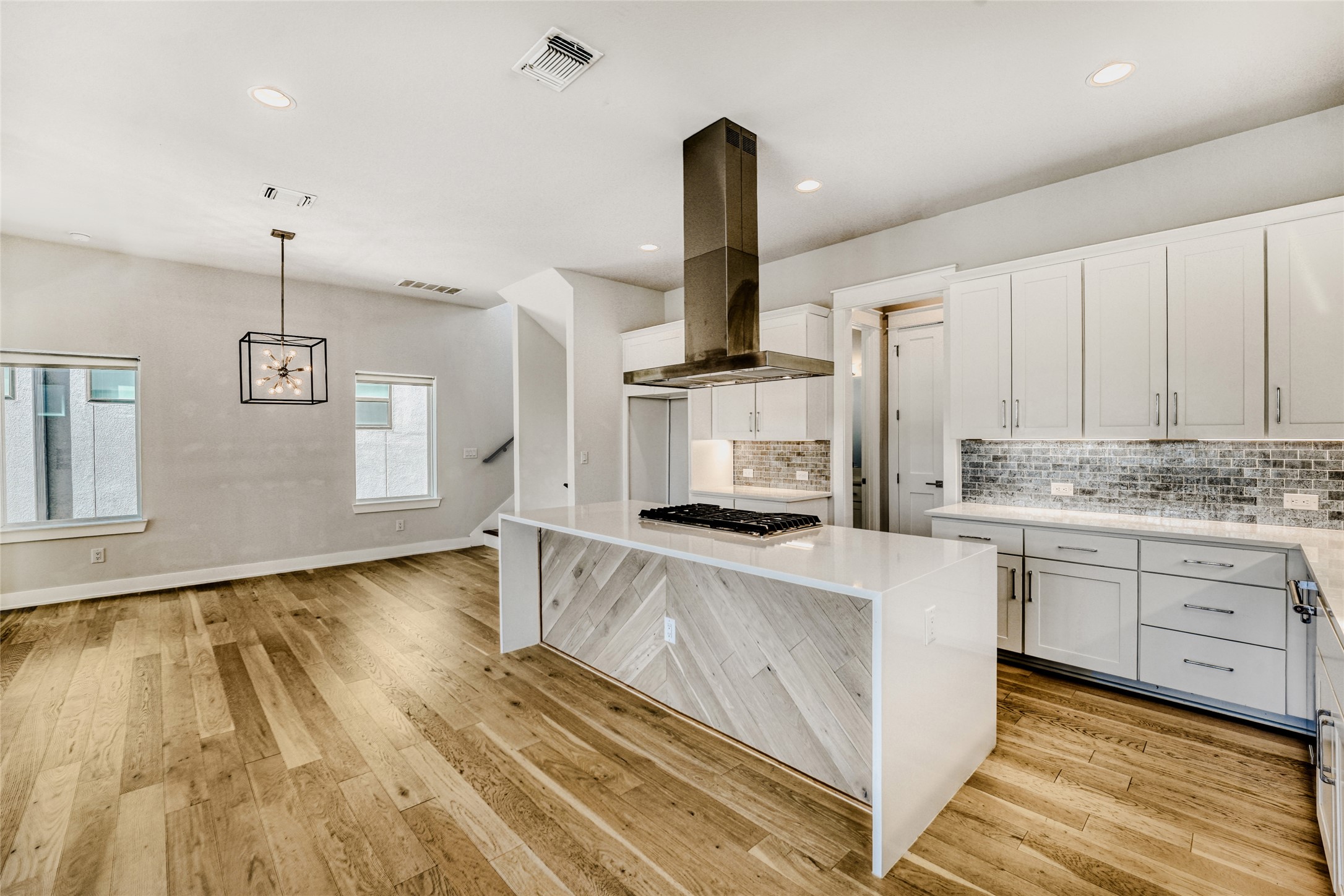 5002 Pecan Springs Road, Unit 6 Austin, TX 78723 - Photo 7 of 29 a kitchen with stainless steel appliances granite countertop a sink a stove and a wooden floors