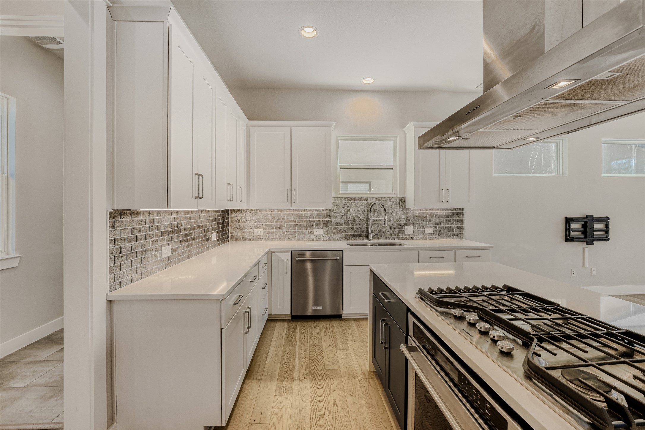 5002 Pecan Springs Road, Unit 6 Austin, TX 78723 - Photo 9 of 29 a kitchen with stainless steel appliances granite countertop a stove and a sink