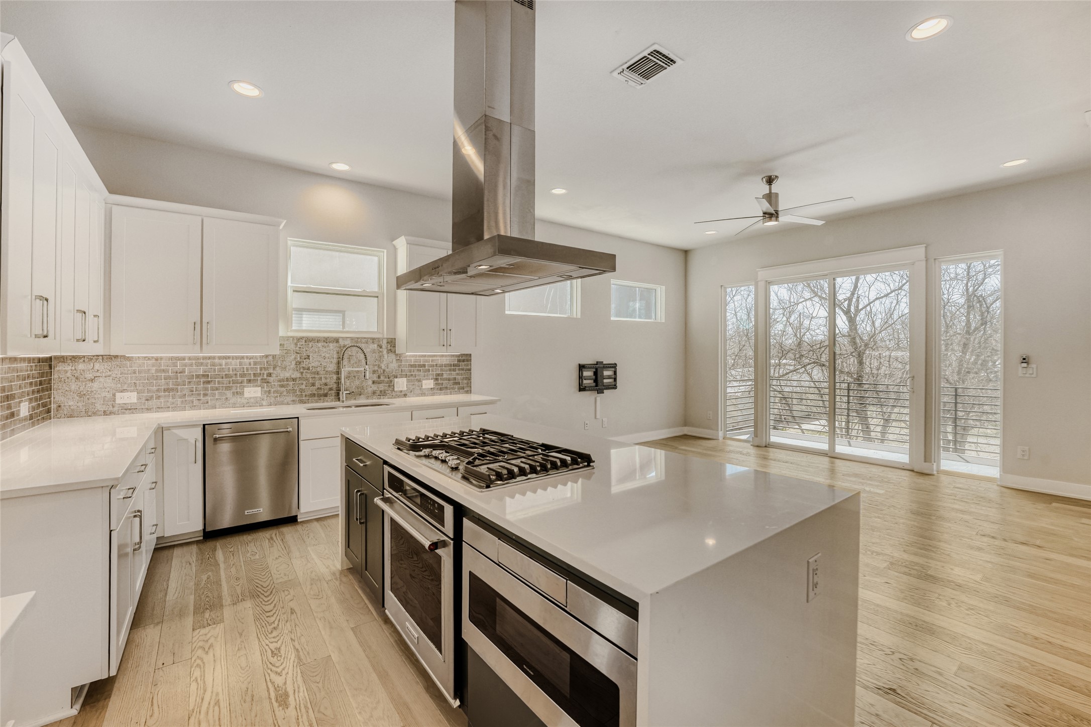 5002 Pecan Springs Road, Unit 6 Austin, TX 78723 - Photo 10 of 29 a kitchen with granite countertop a sink appliances cabinets and a counter top space