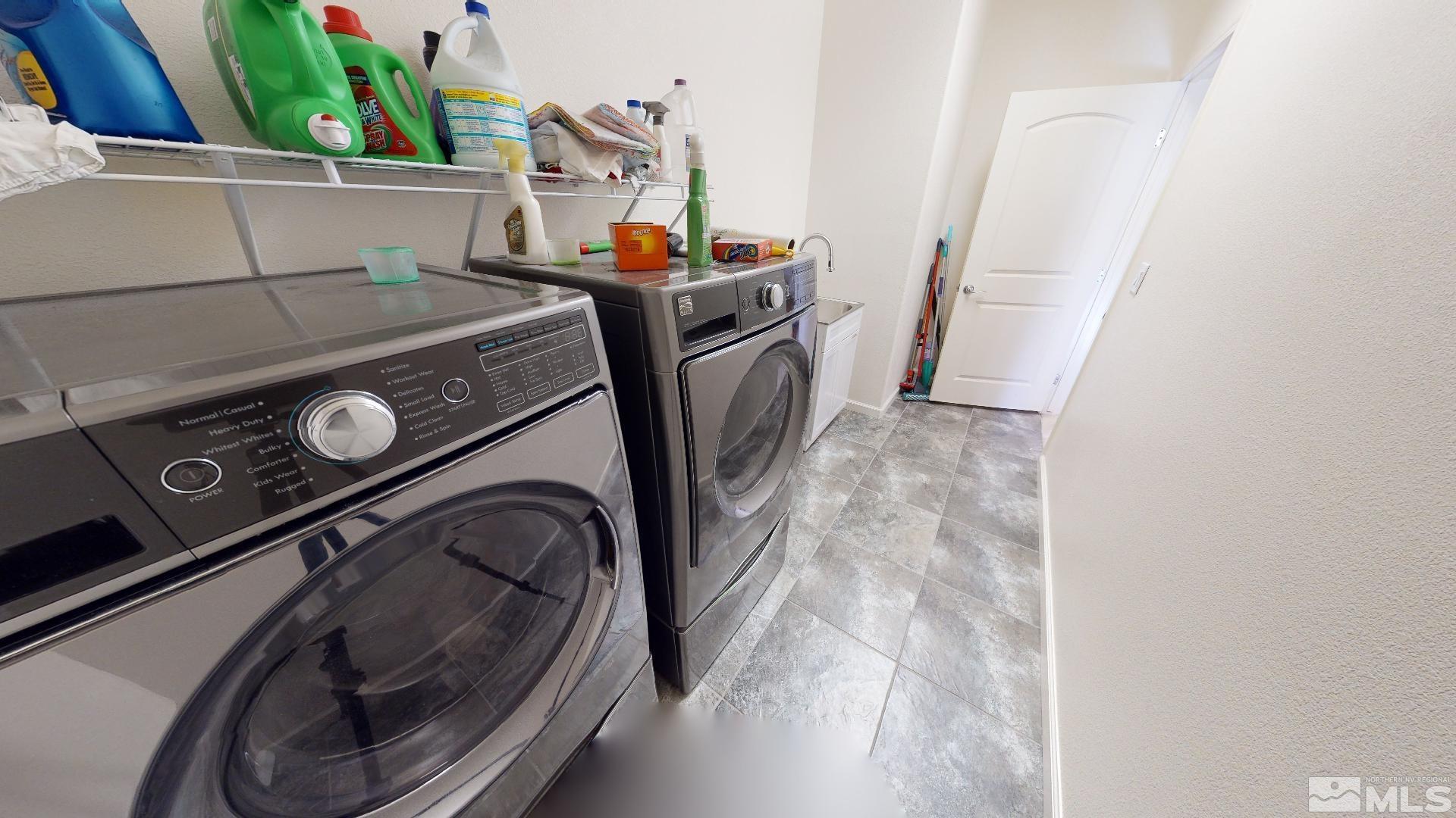 9810 Kerrydale Court Reno, NV 89521 - Photo 13 of 40 a utility room with dryer and washer