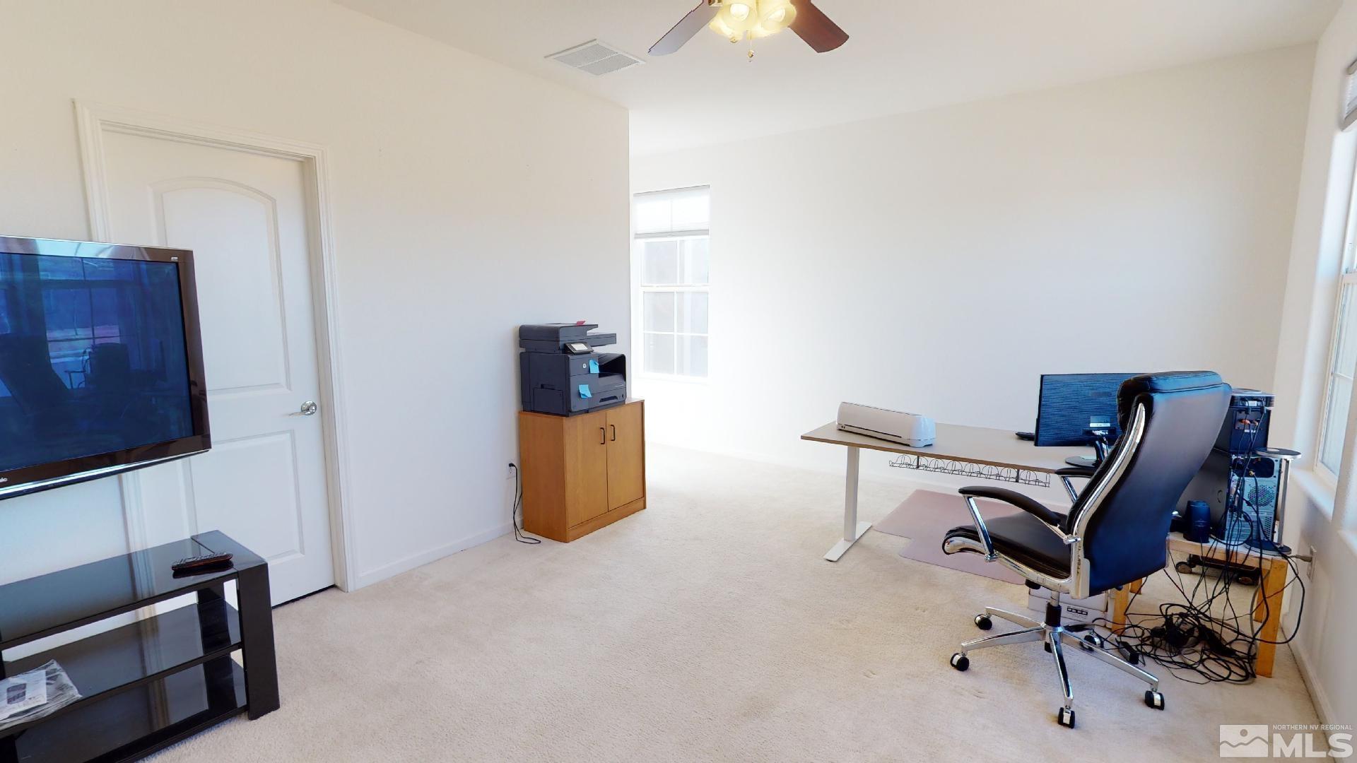 9810 Kerrydale Court Reno, NV 89521 - Photo 17 of 40 a view of a workspace with furniture