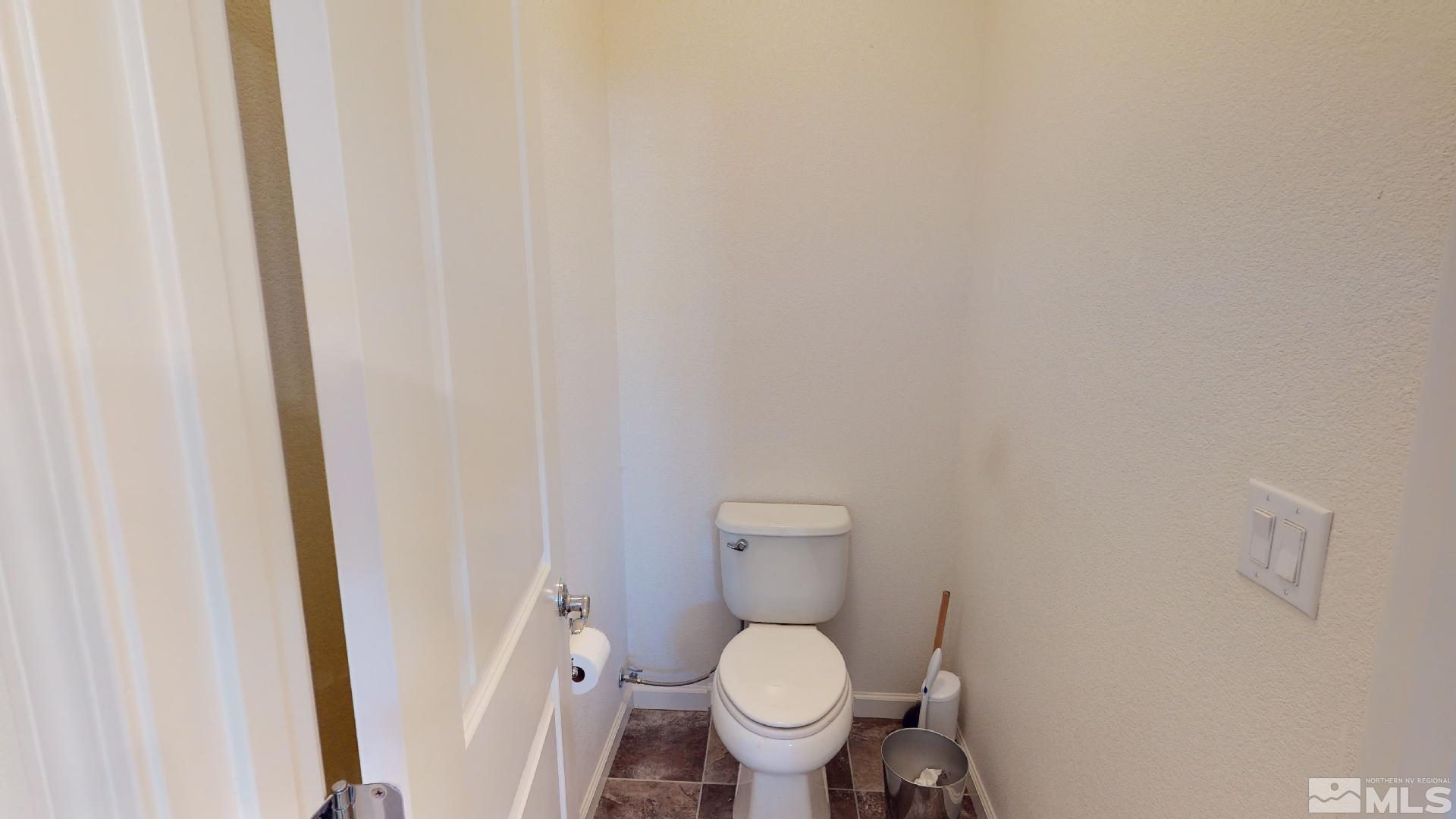 9810 Kerrydale Court Reno, NV 89521 - Photo 26 of 40 a white toilet sitting next to a sink