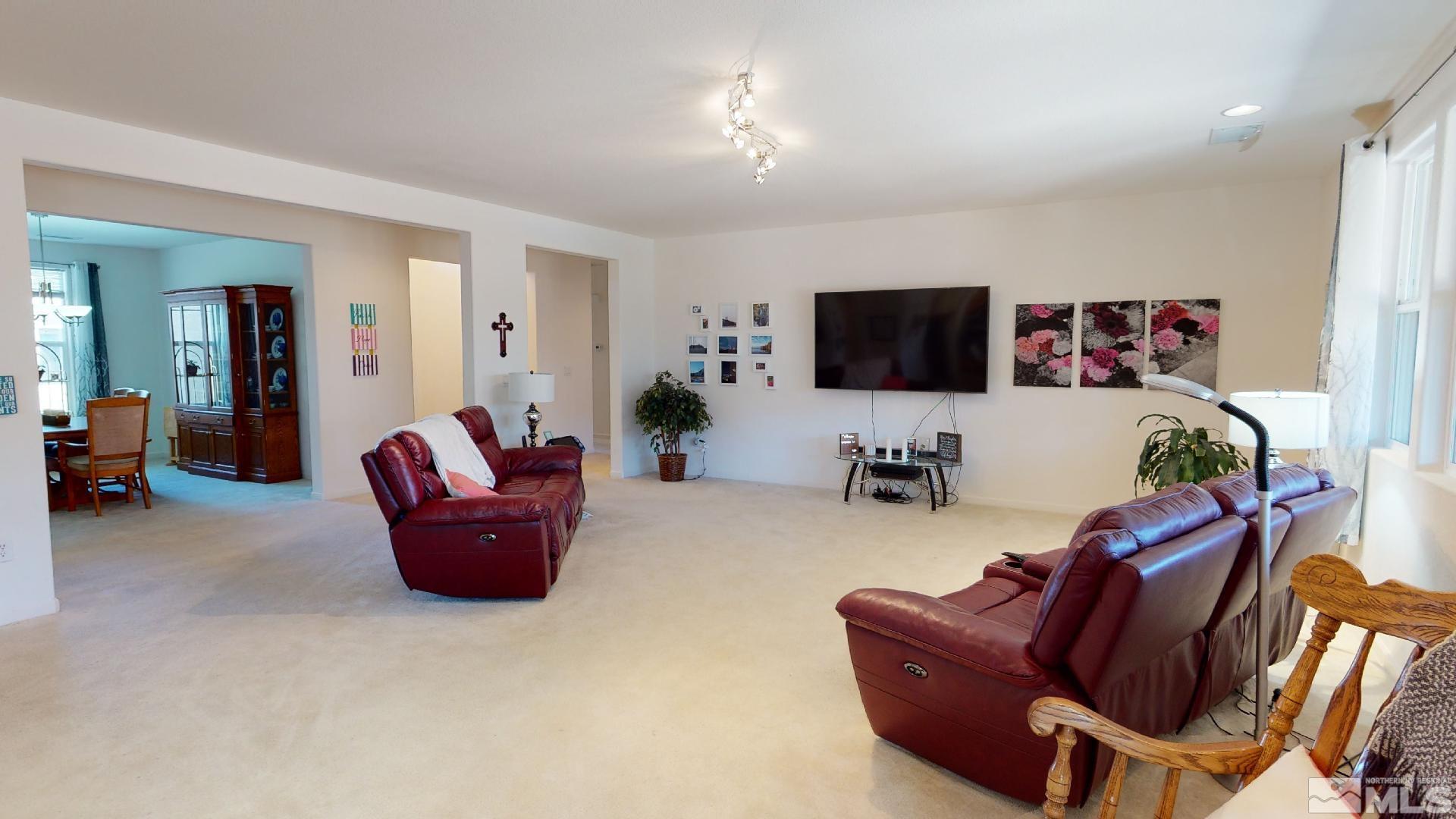 9810 Kerrydale Court Reno, NV 89521 - Photo 4 of 40 a living room with furniture and a flat screen tv