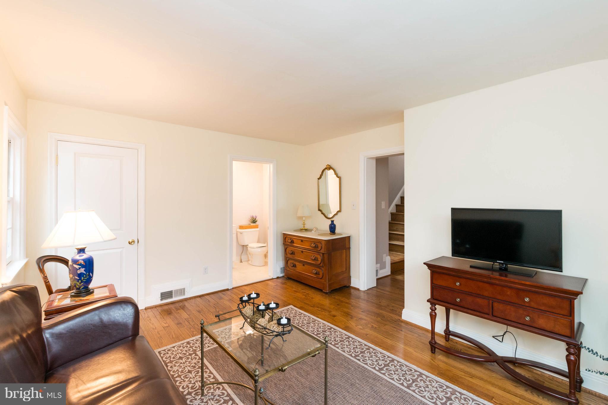 624 Wilton Road Baltimore, MD 21286 - Photo 12 of 30 a living room with furniture and a flat screen tv