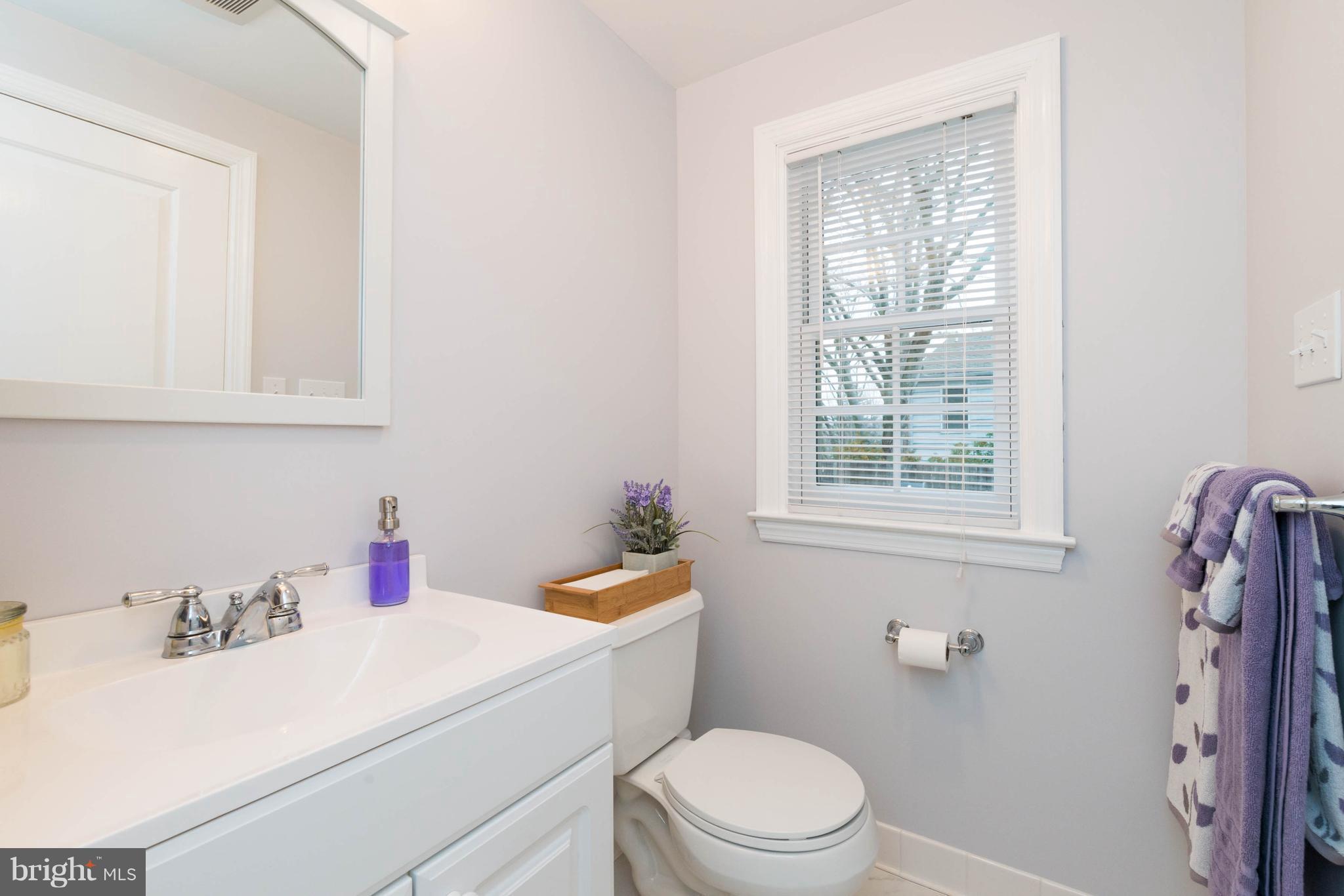 624 Wilton Road Baltimore, MD 21286 - Photo 14 of 30 a bathroom with a sink toilet vanity and window