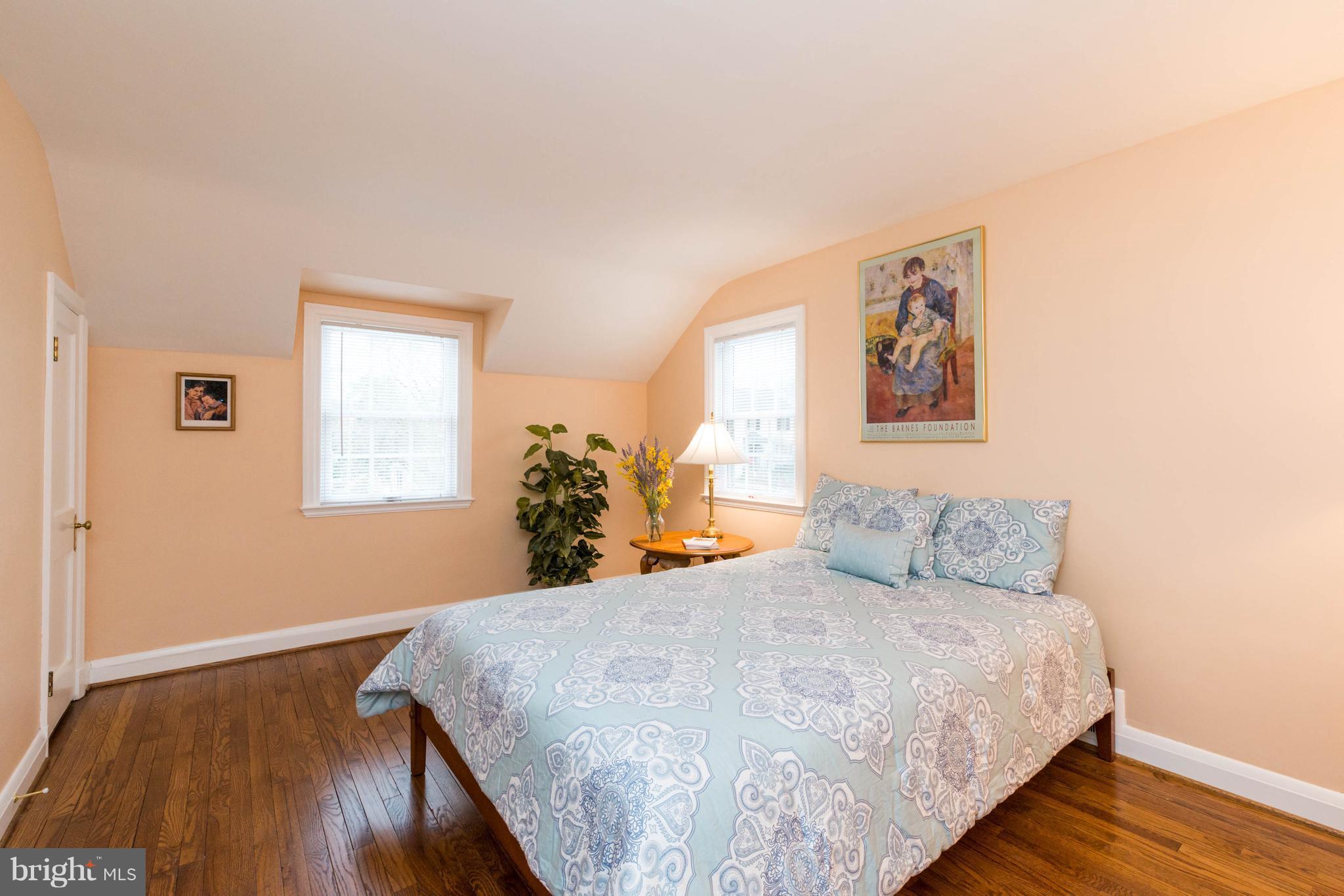 624 Wilton Road Baltimore, MD 21286 - Photo 17 of 30 a bedroom with a bed and wooden floor