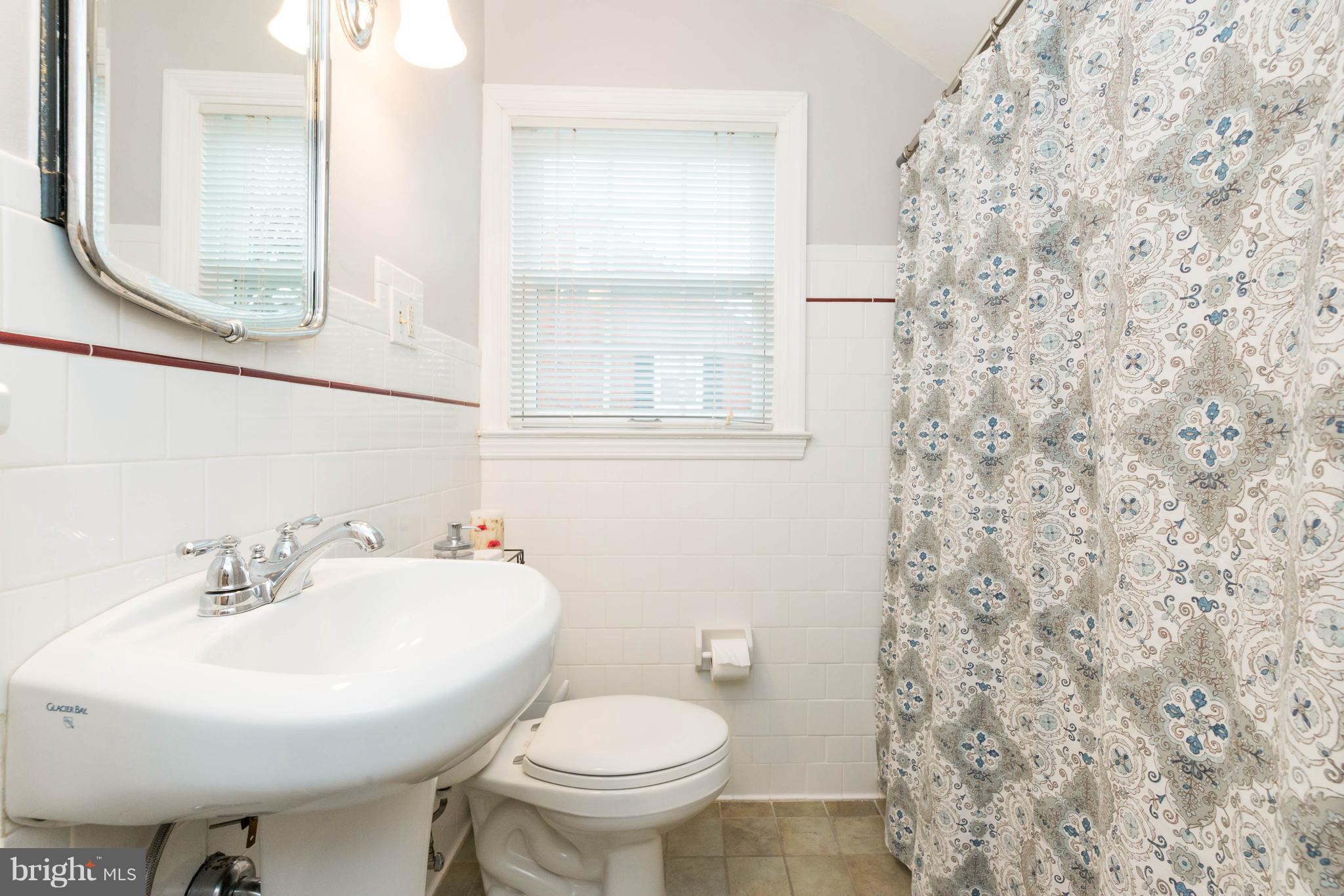 624 Wilton Road Baltimore, MD 21286 - Photo 18 of 30 a bathroom with a sink and a mirror
