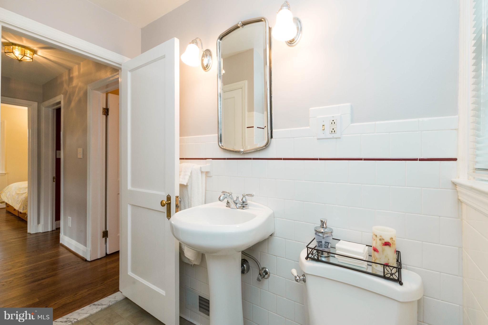 624 Wilton Road Baltimore, MD 21286 - Photo 19 of 30 a bathroom with a sink and a mirror