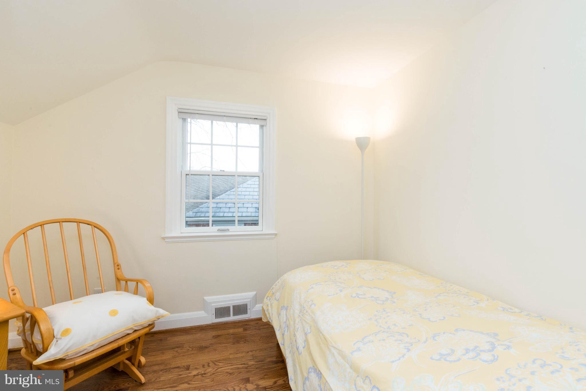 624 Wilton Road Baltimore, MD 21286 - Photo 20 of 30 a bedroom with a bed chair and window