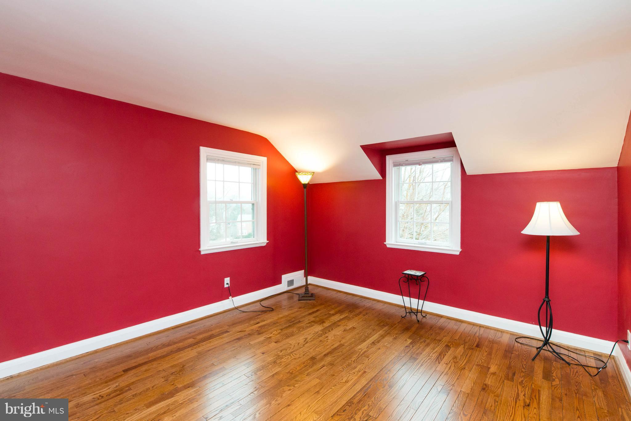 624 Wilton Road Baltimore, MD 21286 - Photo 22 of 30 a view of an empty room with window and wooden floor