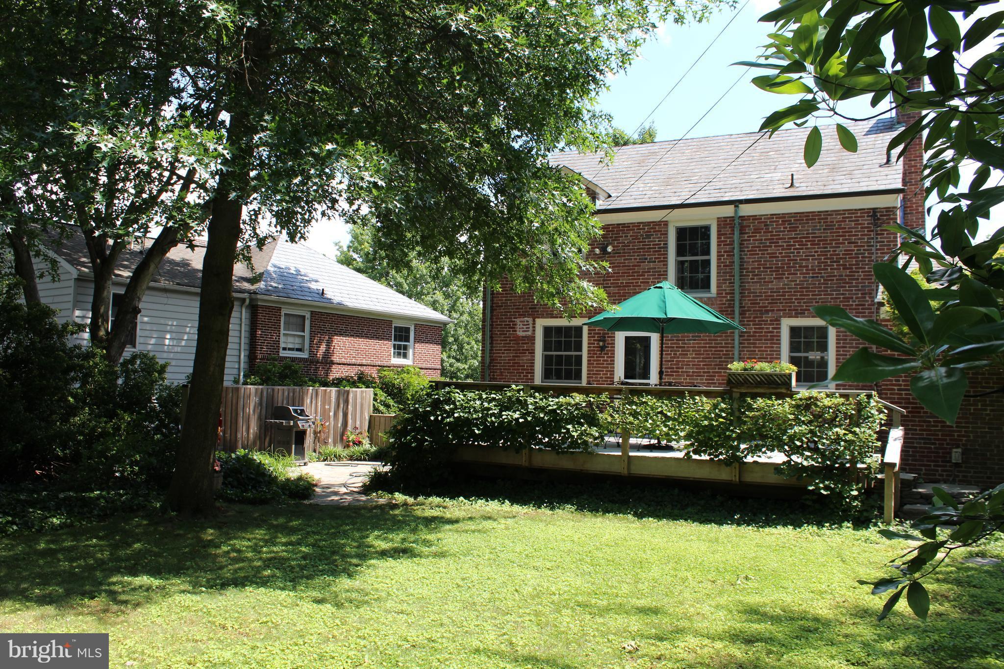 624 Wilton Road Baltimore, MD 21286 - Photo 26 of 30 a front view of a house with a garden and plants