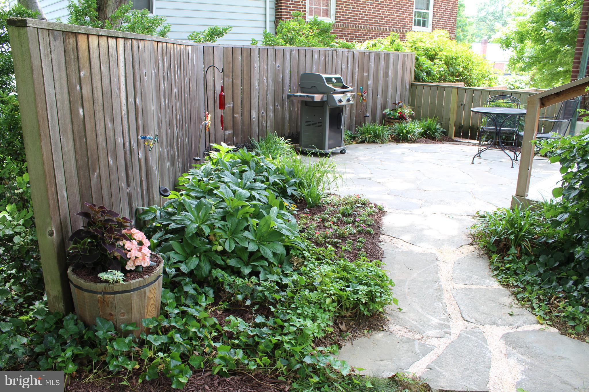 624 Wilton Road Baltimore, MD 21286 - Photo 28 of 30 a garden with plants and wooden fence