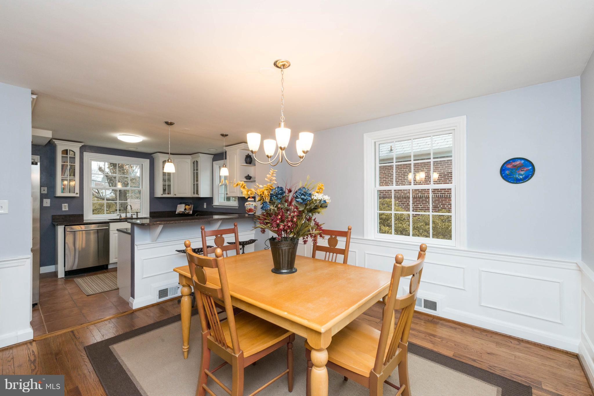 624 Wilton Road Baltimore, MD 21286 - Photo 7 of 30 a view of a dining room with furniture and wooden floor
