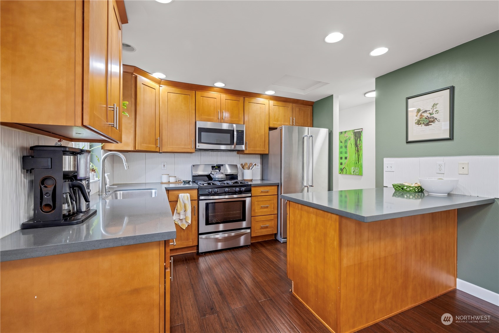 2847 Southwest Dakota Street Seattle, WA 98126 - Photo 12 of 39 a kitchen with stainless steel appliances a stove a sink and a refrigerator