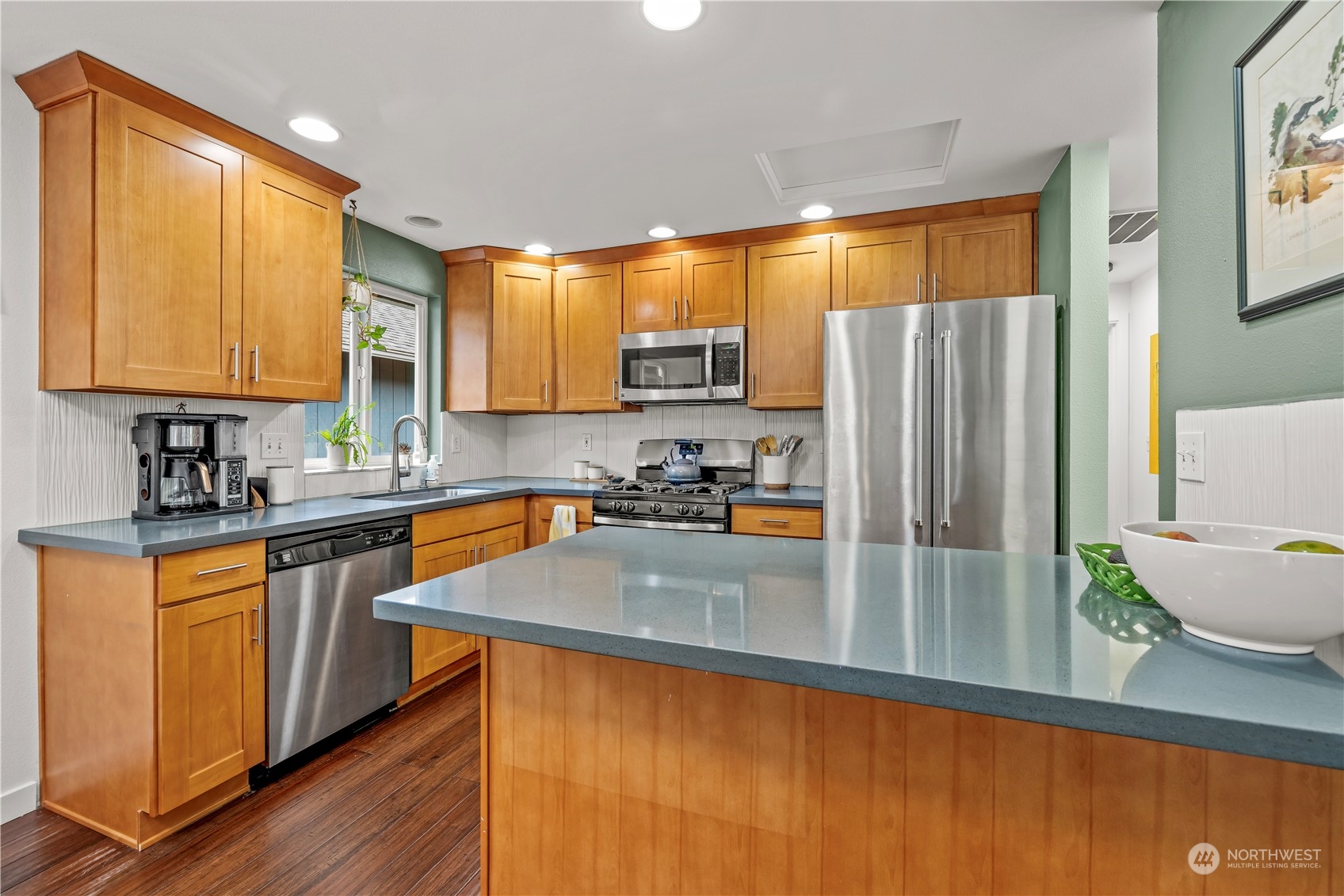 2847 Southwest Dakota Street Seattle, WA 98126 - Photo 13 of 39 a kitchen with stainless steel appliances granite countertop a refrigerator a sink and a stove