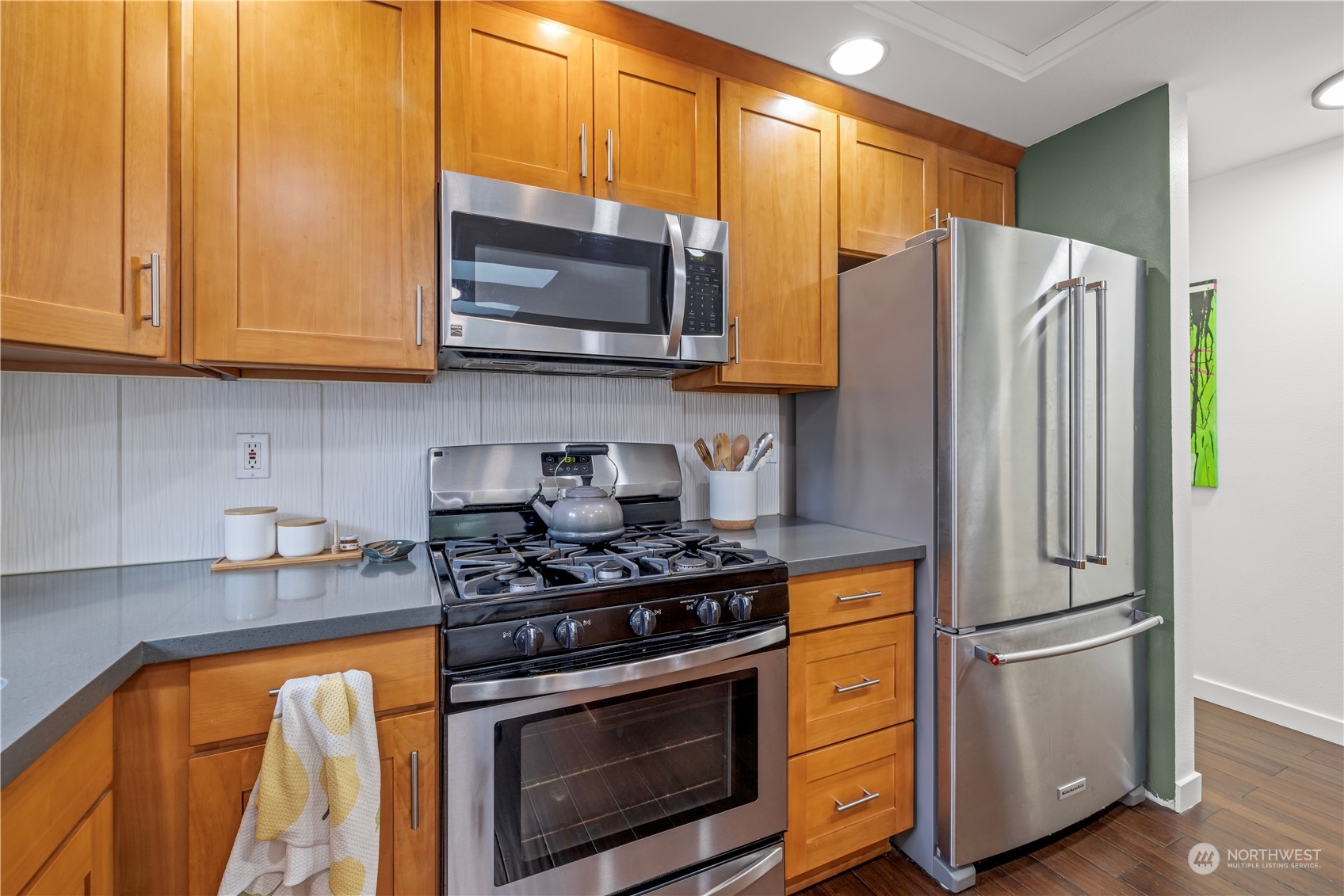2847 Southwest Dakota Street Seattle, WA 98126 - Photo 14 of 39 a kitchen with stainless steel appliances granite countertop a refrigerator stove and microwave
