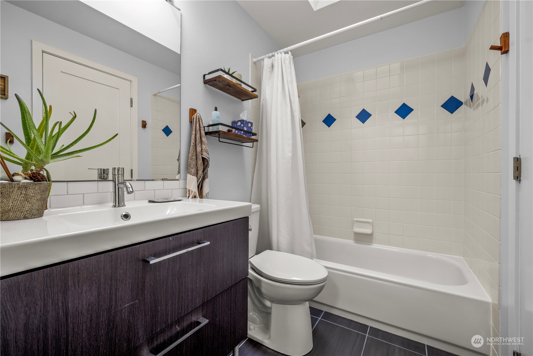 2847 Southwest Dakota Street Seattle, WA 98126 - Photo 18 of 39 a bathroom with a sink a toilet and a bathtub