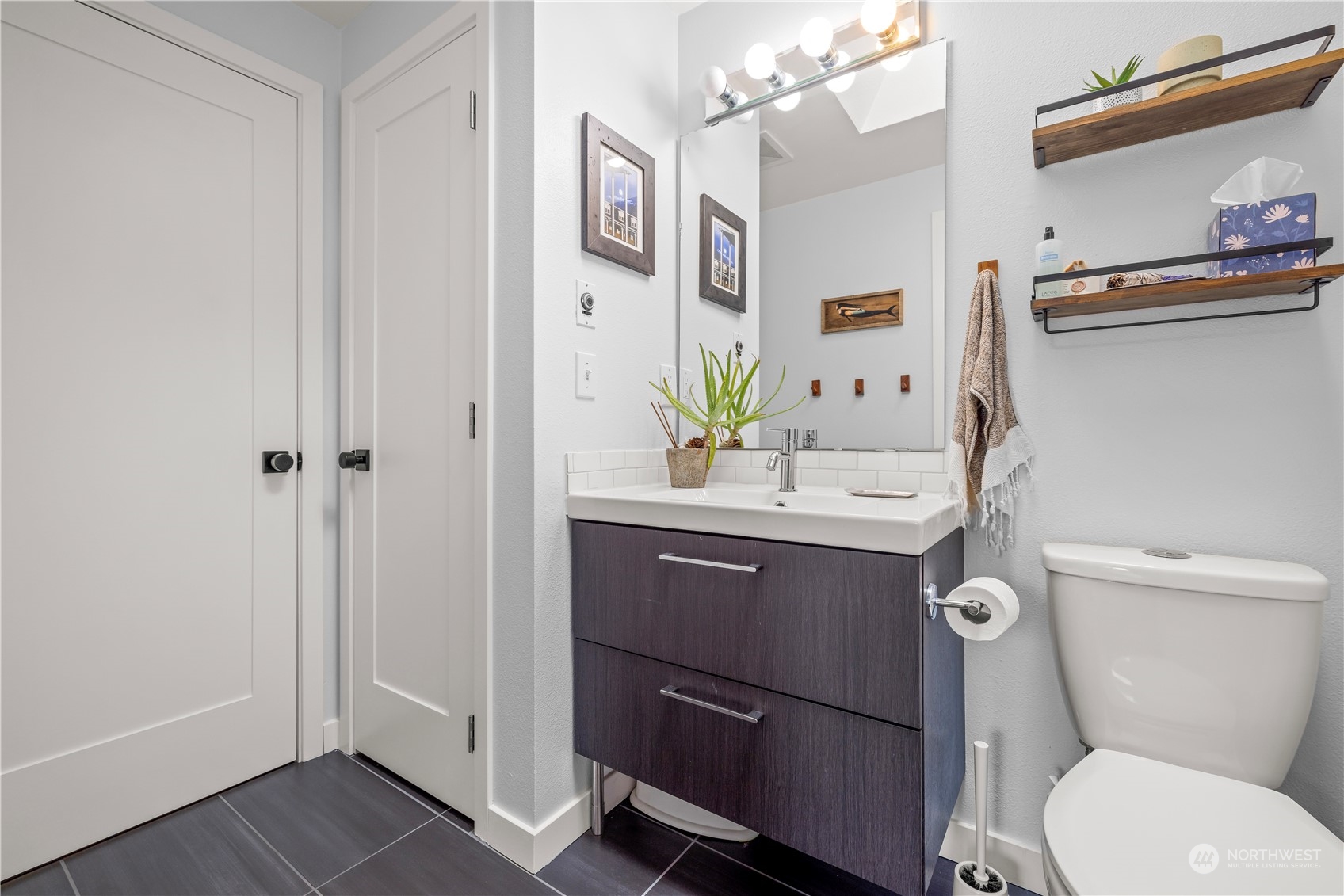 2847 Southwest Dakota Street Seattle, WA 98126 - Photo 19 of 39 a bathroom with a sink vanity mirror and toilet