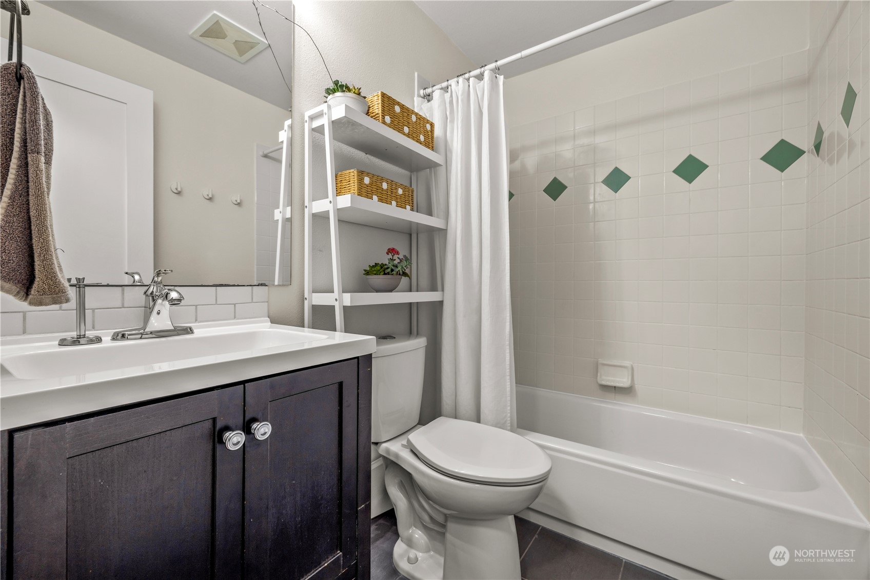 2847 Southwest Dakota Street Seattle, WA 98126 - Photo 23 of 39 a bathroom with a sink a toilet and shower