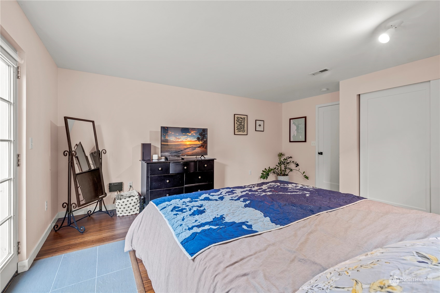 2847 Southwest Dakota Street Seattle, WA 98126 - Photo 25 of 39 a bedroom with a bed a flat screen tv and dresser