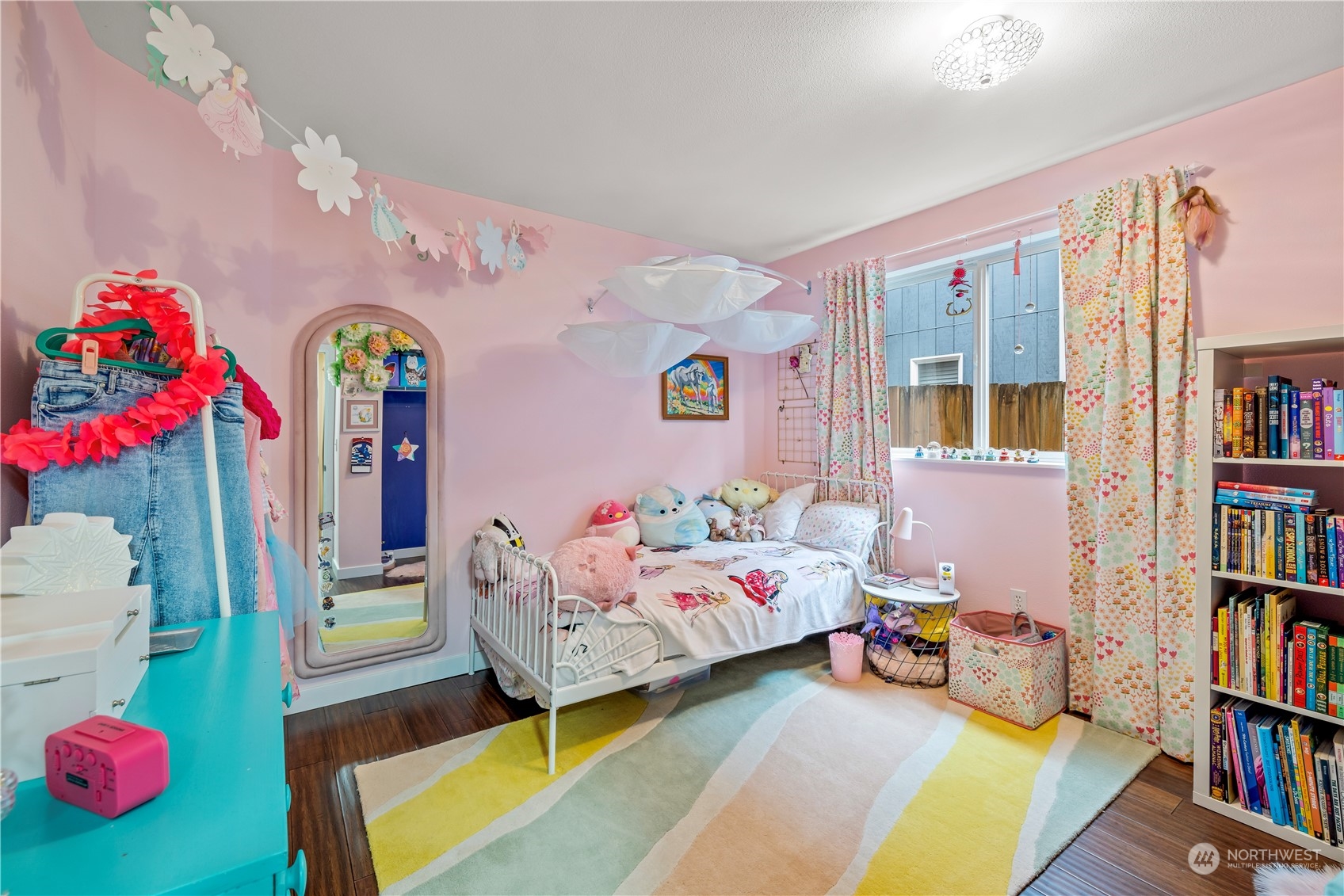 2847 Southwest Dakota Street Seattle, WA 98126 - Photo 26 of 39 a bedroom with bed and a book shelf