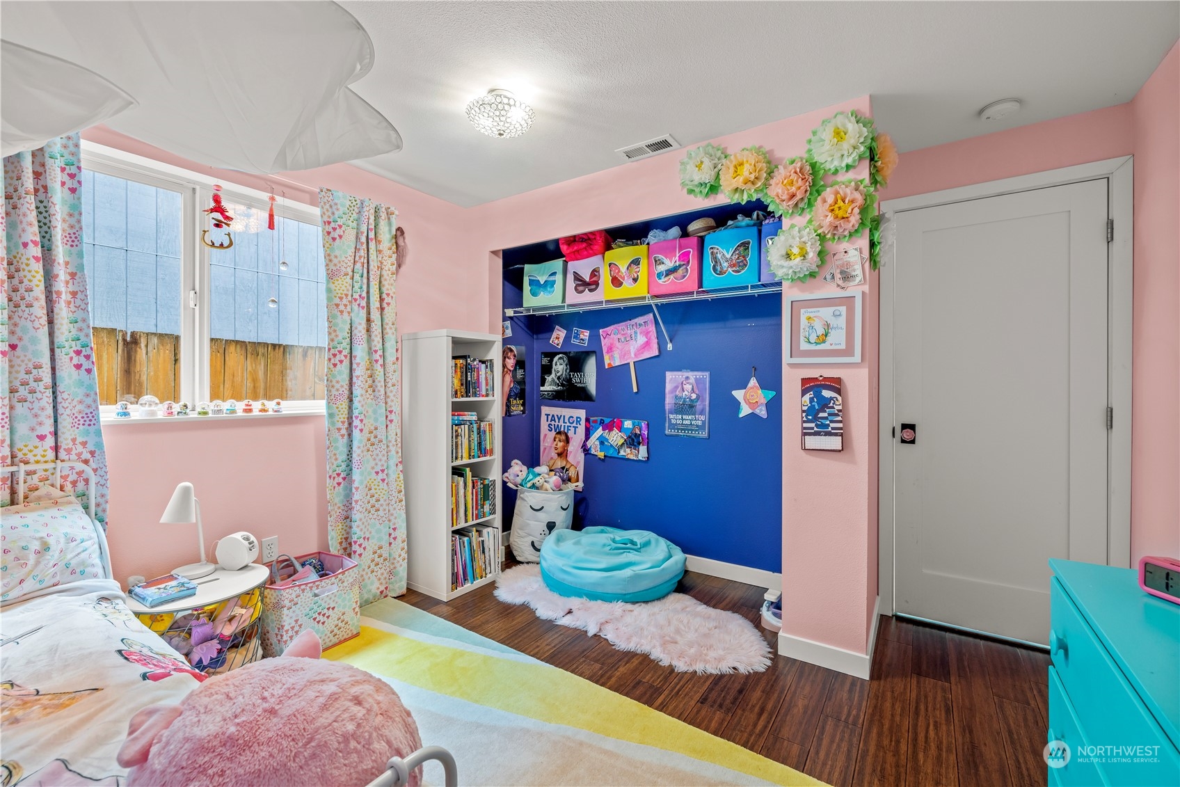 2847 Southwest Dakota Street Seattle, WA 98126 - Photo 27 of 39 a bedroom with furniture and a wooden floor