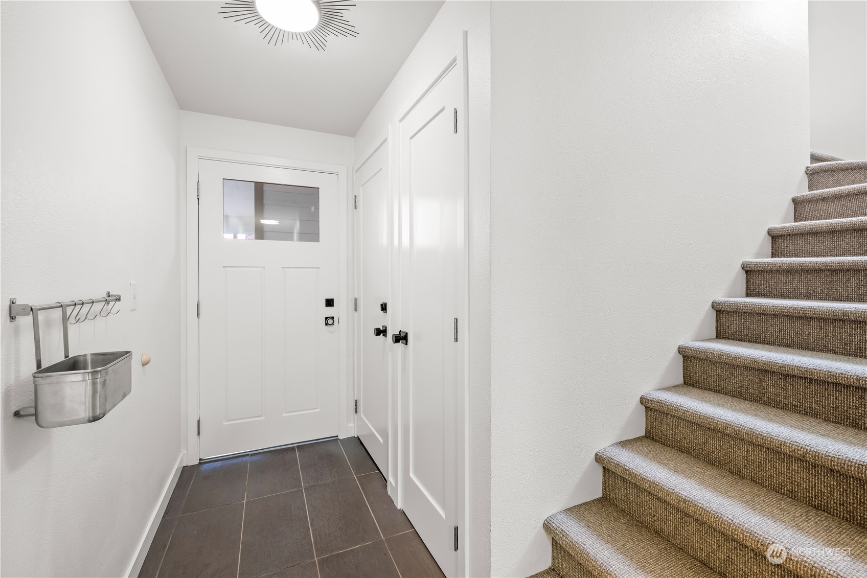 2847 Southwest Dakota Street Seattle, WA 98126 - Photo 3 of 39 a view of entryway and hall with wooden floor