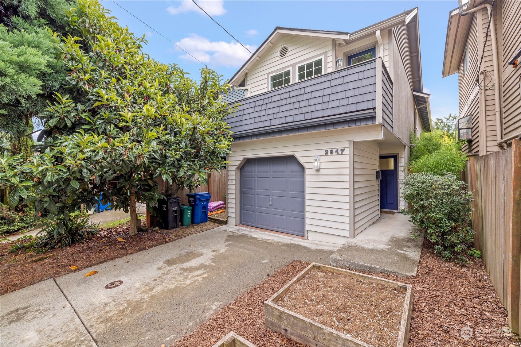 2847 Southwest Dakota Street Seattle, WA 98126 - Photo 31 of 39 a view of a house with a yard and garage