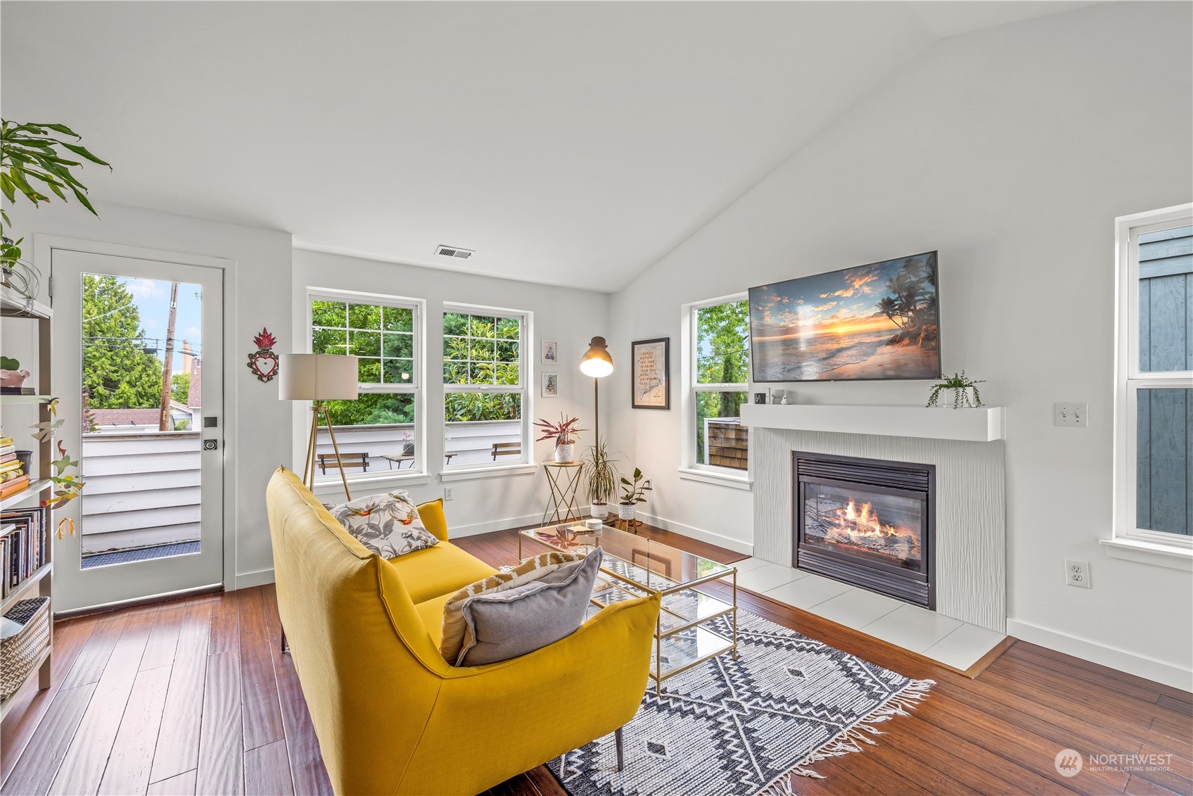 2847 Southwest Dakota Street Seattle, WA 98126 - Photo 4 of 39 a living room with furniture and a fireplace