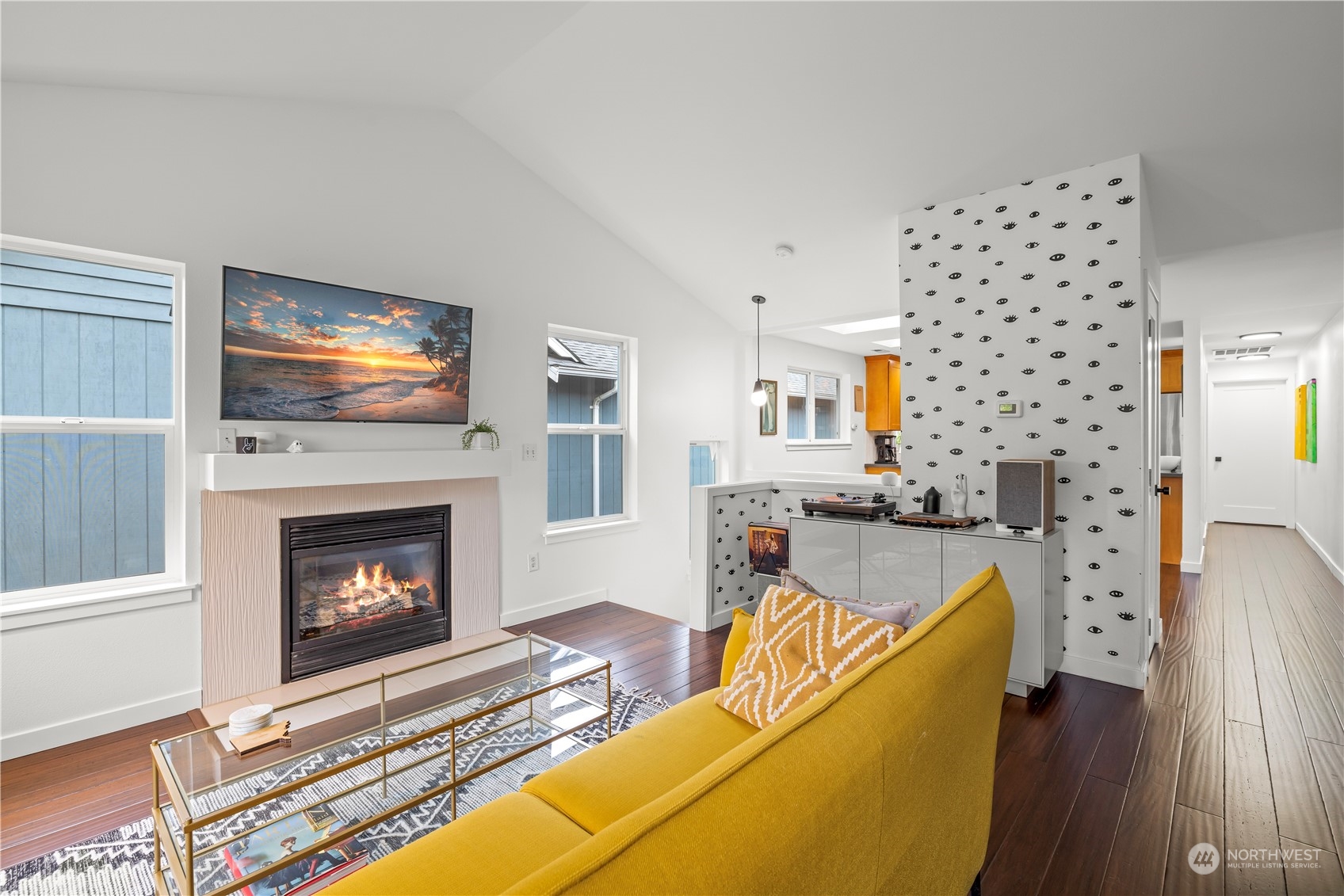 2847 Southwest Dakota Street Seattle, WA 98126 - Photo 8 of 39 a living room with furniture a fireplace and a flat screen tv