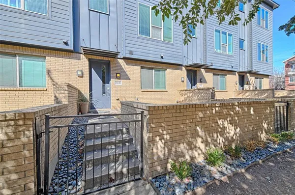 a front view of a building with garden