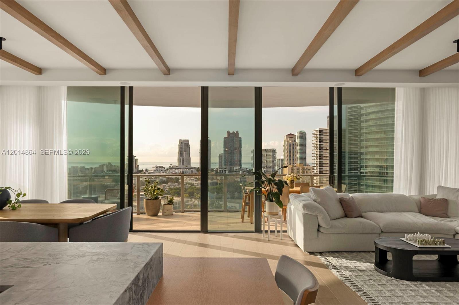 500 Alton Road, Unit 1601 Miami Beach, FL 33139 - Photo 1 of 20 a living room with furniture and a floor to ceiling window