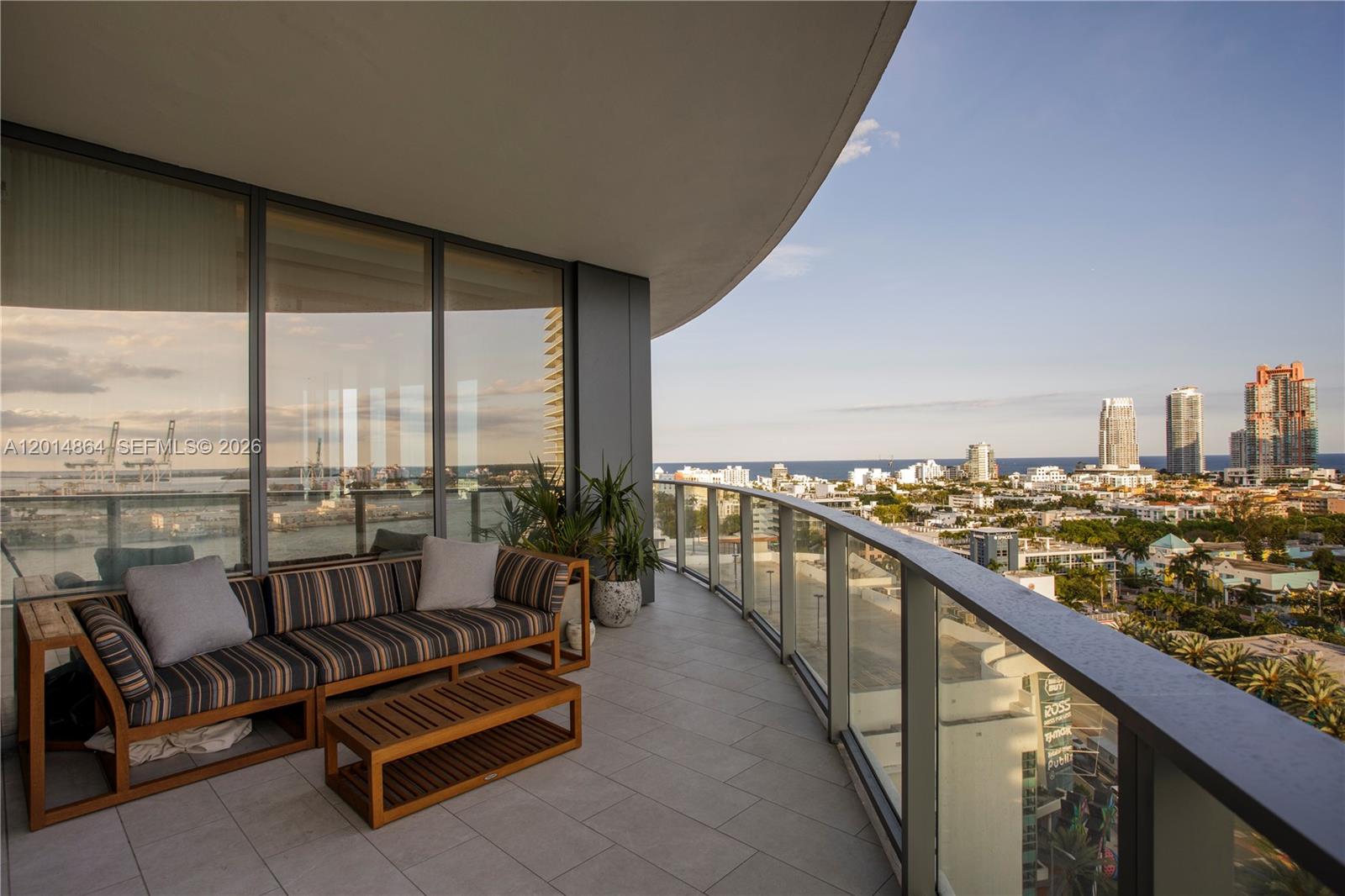 500 Alton Road, Unit 1601 Miami Beach, FL 33139 - Photo 16 of 20 a balcony with furniture and city view