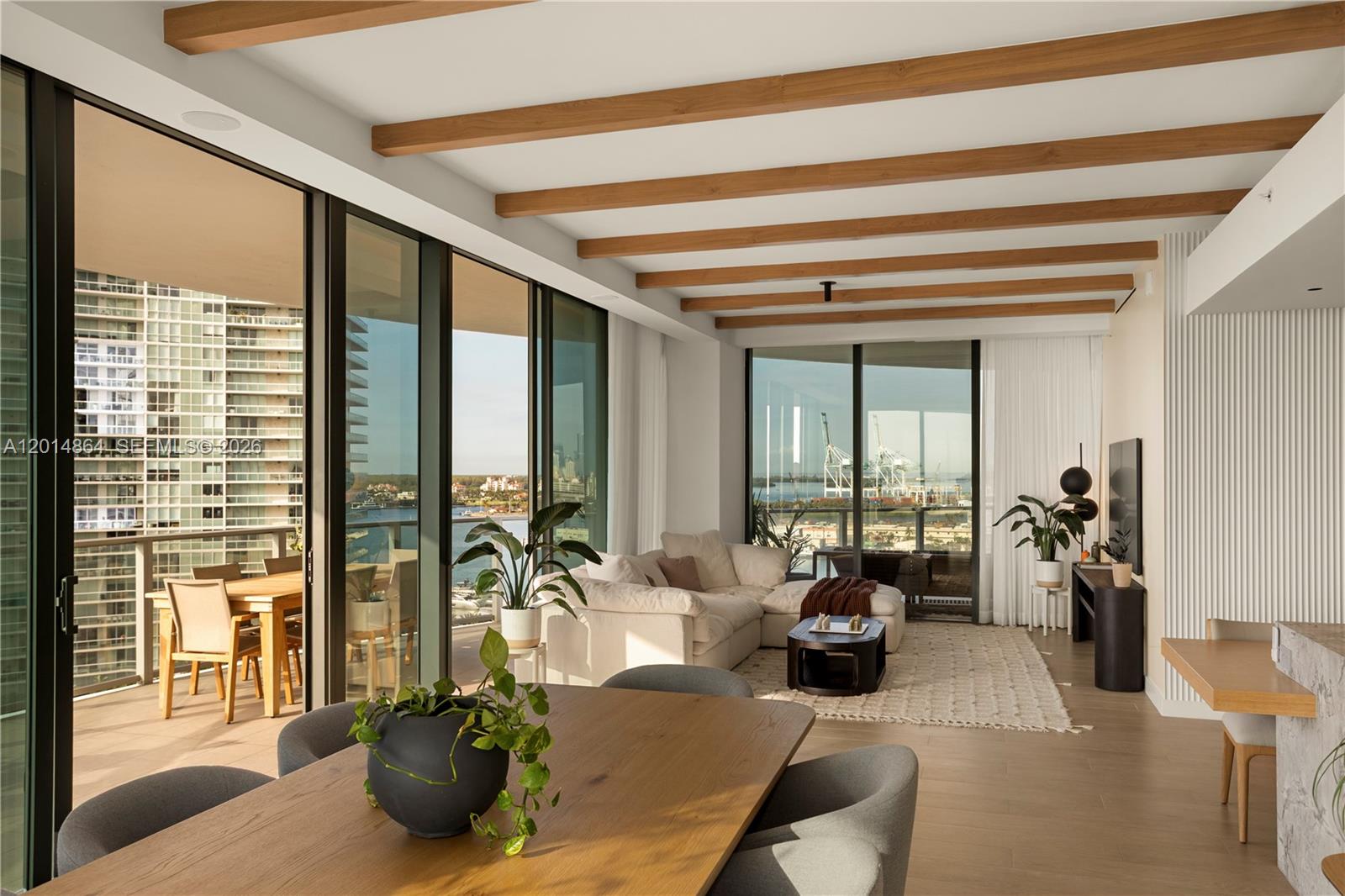 500 Alton Road, Unit 1601 Miami Beach, FL 33139 - Photo 2 of 20 a living room with furniture and a large window
