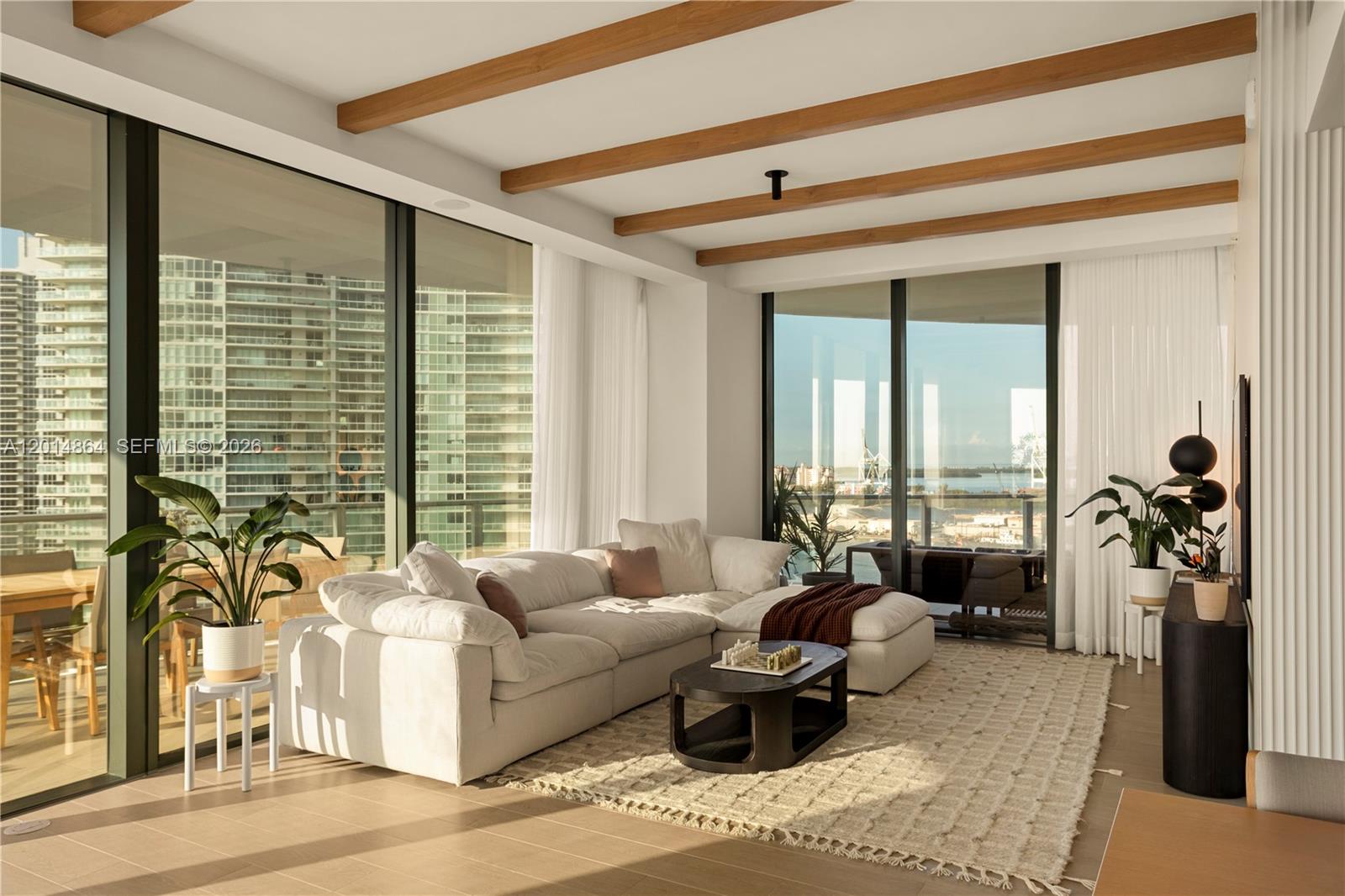 500 Alton Road, Unit 1601 Miami Beach, FL 33139 - Photo 3 of 20 a living room with furniture and a large window