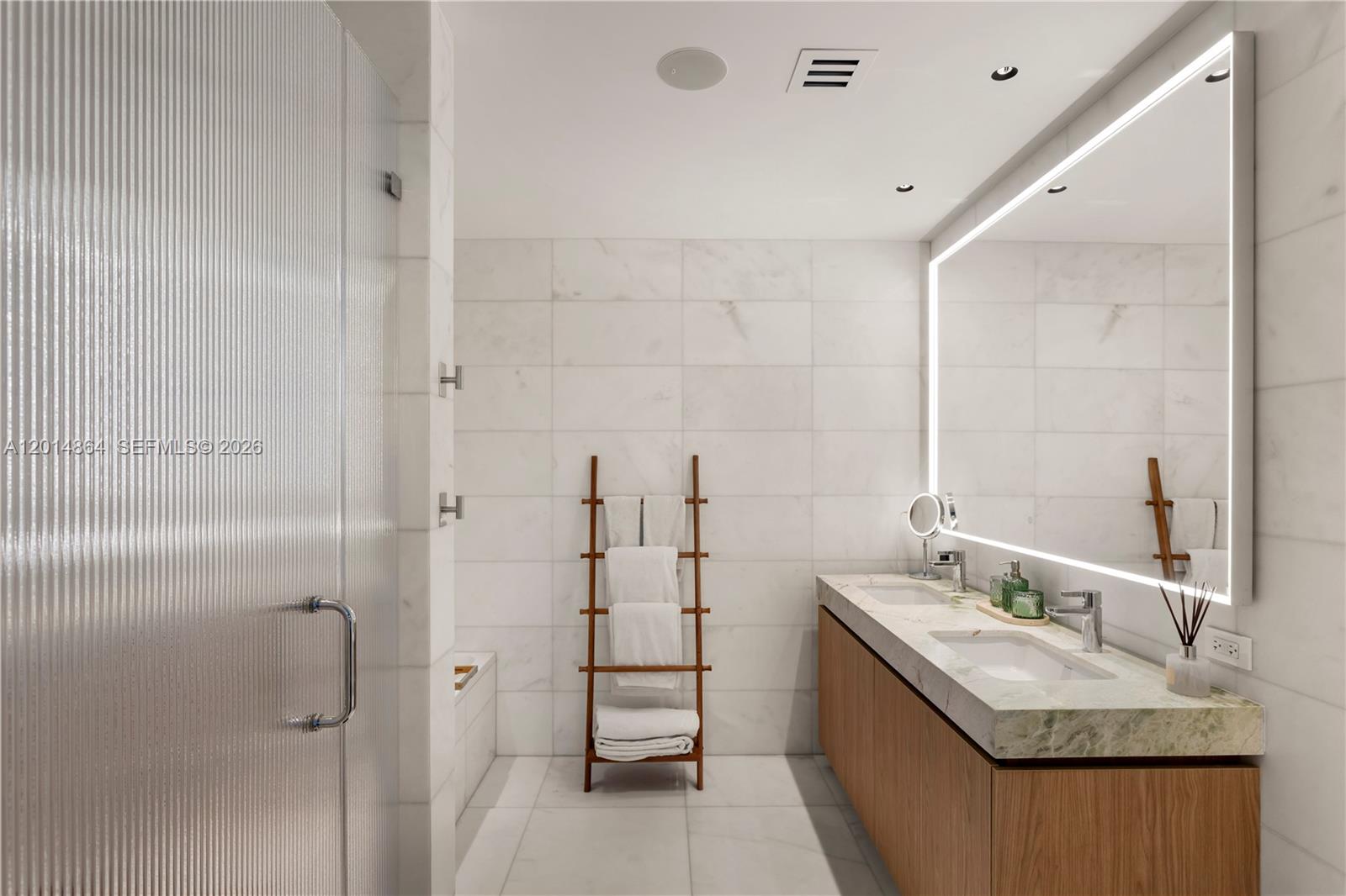500 Alton Road, Unit 1601 Miami Beach, FL 33139 - Photo 7 of 20 a bathroom with a granite countertop sink a mirror and shower