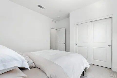 a bedroom with a bed and a shower
