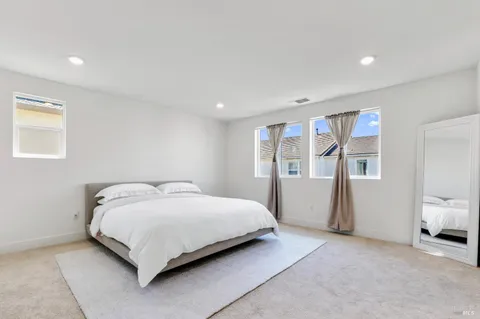 a bedroom with a bed and a view of bedroom